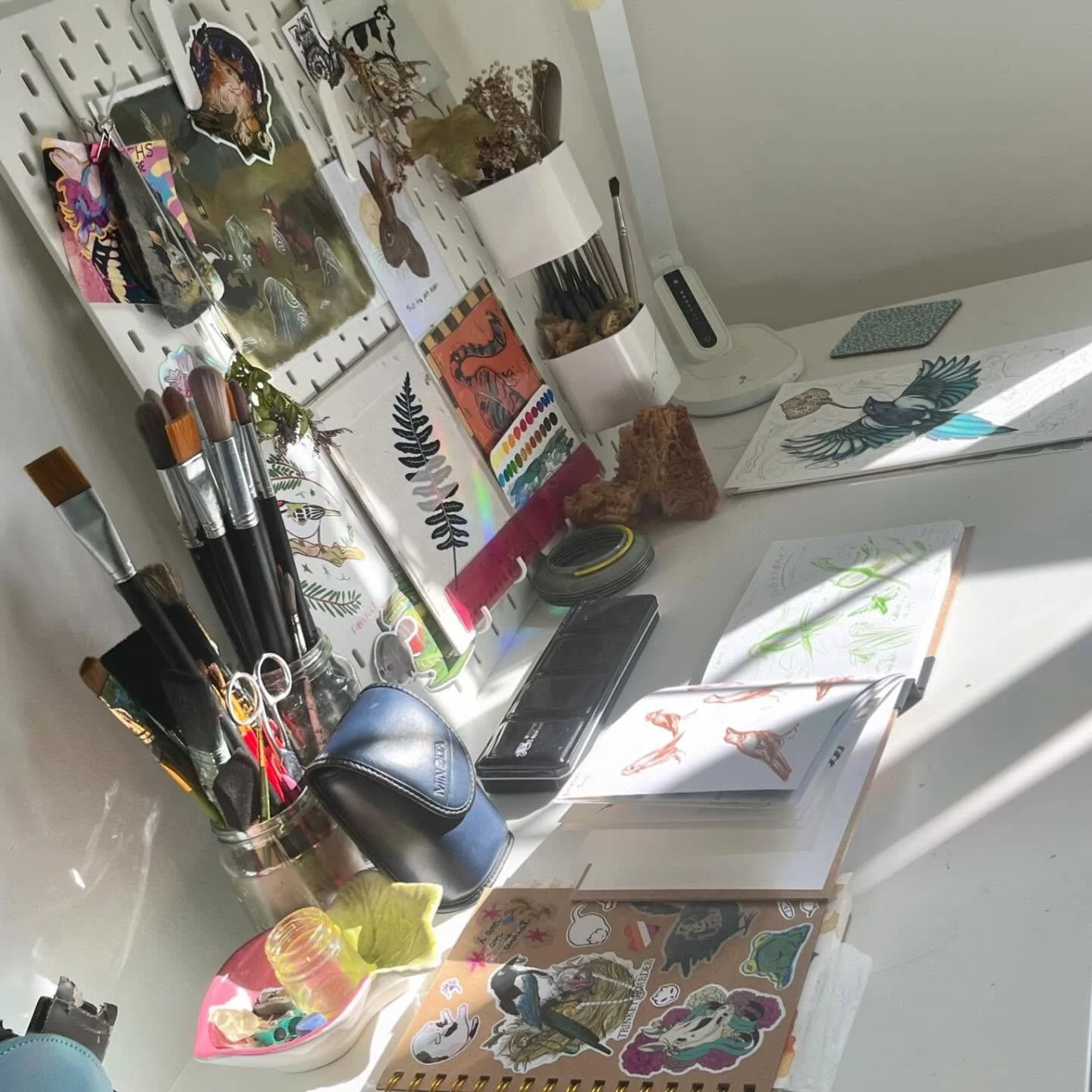 Enjoying the rays of sun and the rainbows in my studio today. 🌈✨ I recommend window sun catcher stickers to bring all of the rainbows and good vibes!