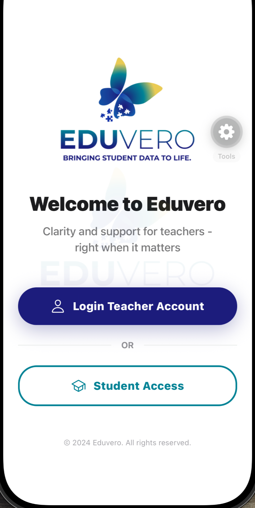 Eduvero app login screen featuring a butterfly logo, the name Eduvero, and options to log in as a teacher or student.