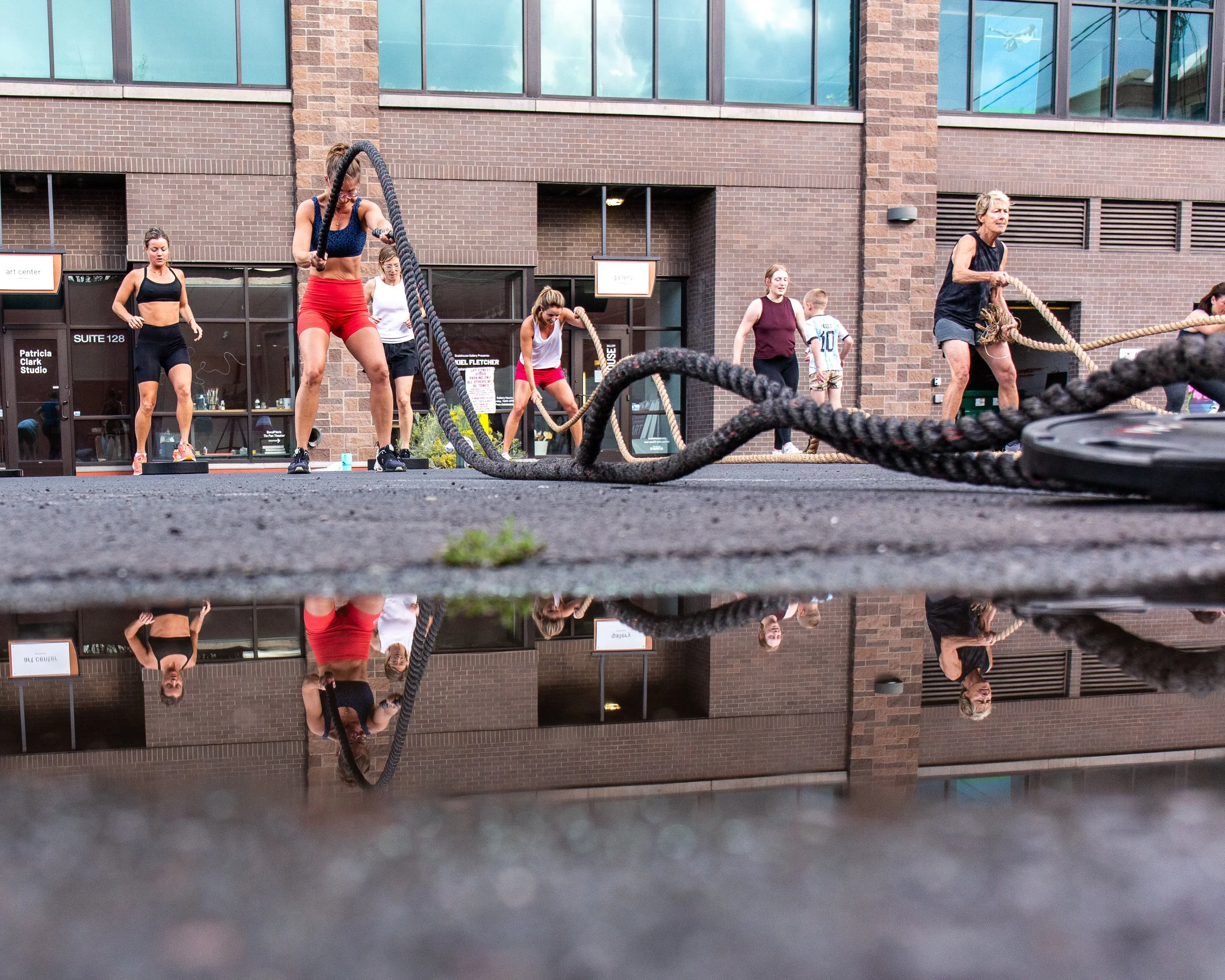 Group of athletes training outside in a courtyard for a commercial photographer in Bend Oregon