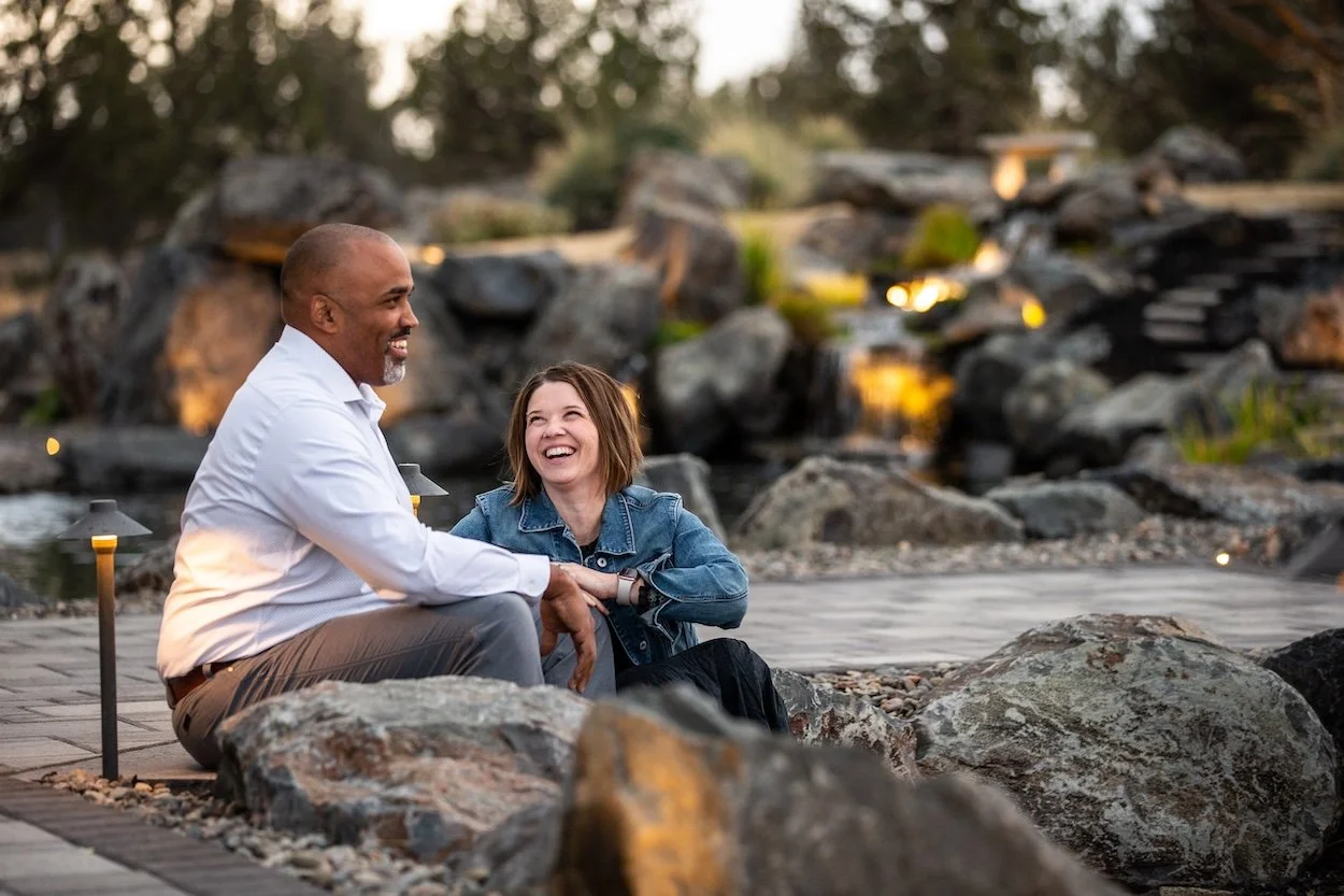 Middle-aged couple laughing outside for a commercial photoshoot in Bend Oregon Tethero Resort