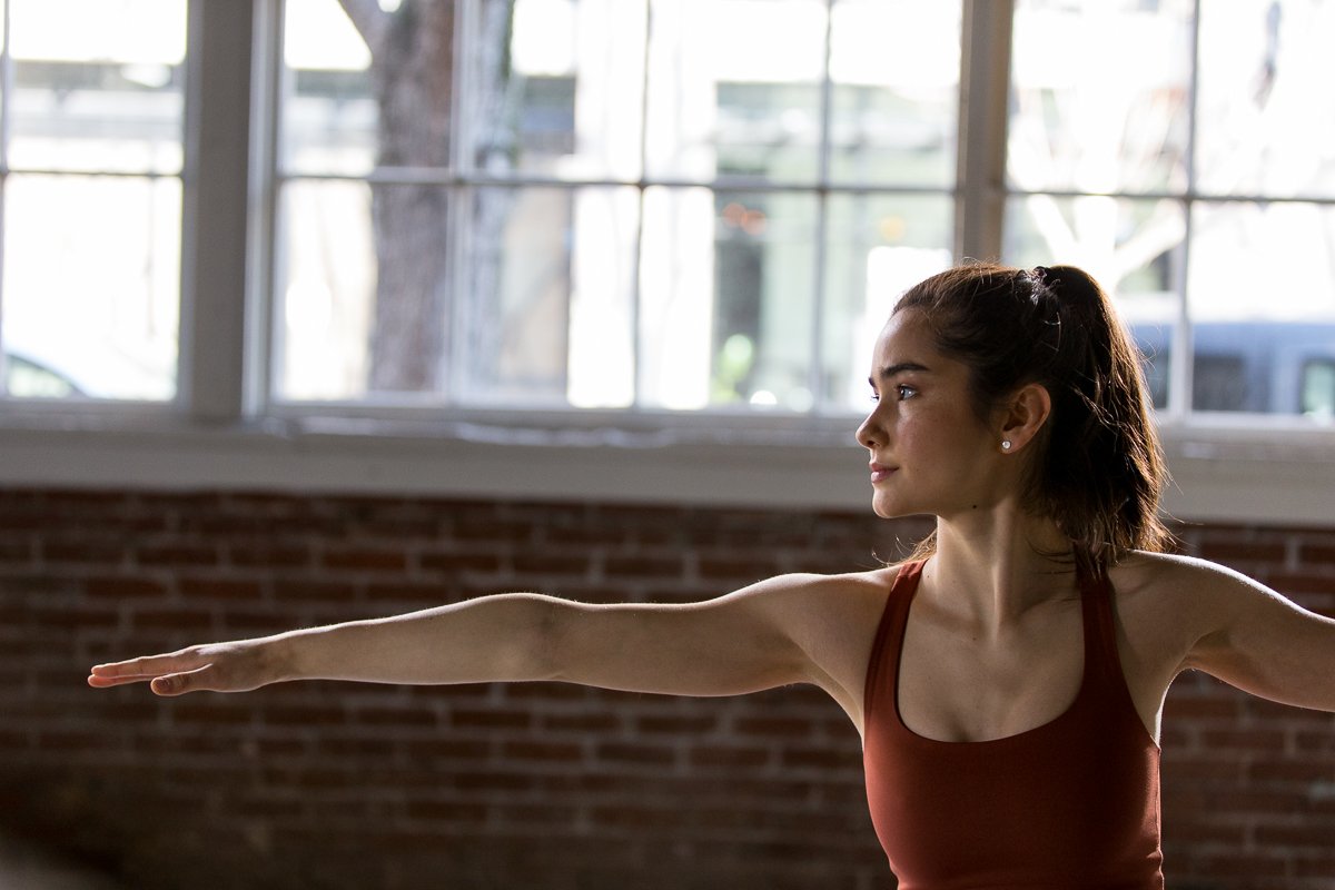 Dark-haired female yogi in a athletic wear commercial photo shoot in Bend Oregon for Hex brand. 