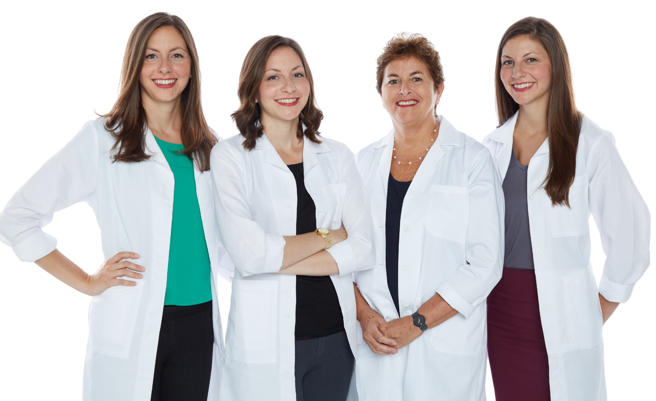Dr Janet Gersten and her triplet daughters, all OBGYNs, shown here in a group photo in lap coats.