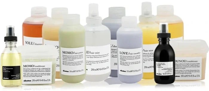 Collection of hair and scalp treatment bottles and containers, including shampoos, conditioners, hair mist, and scalp elixirs, in various sizes and colors.