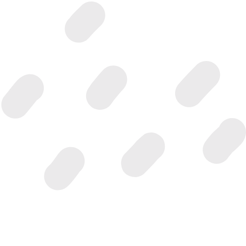 Several white pills scattered on a black background.
