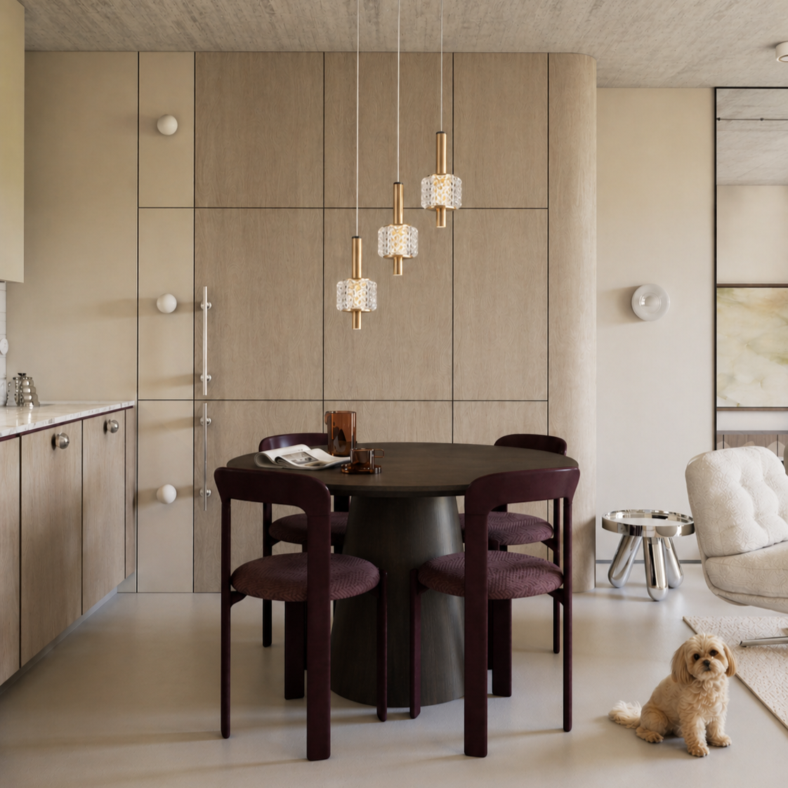 Modern dining area with hanging pendant lights, a round black table, four burgundy chairs, a side table, a cream-colored armchair, and a small dog on a beige rug.