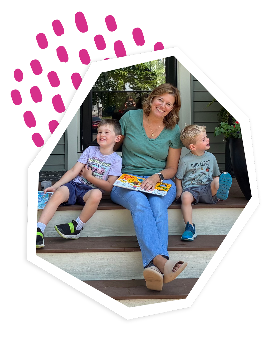 Photo of a grandma sitting with her two grandsons and children's books on a porch.