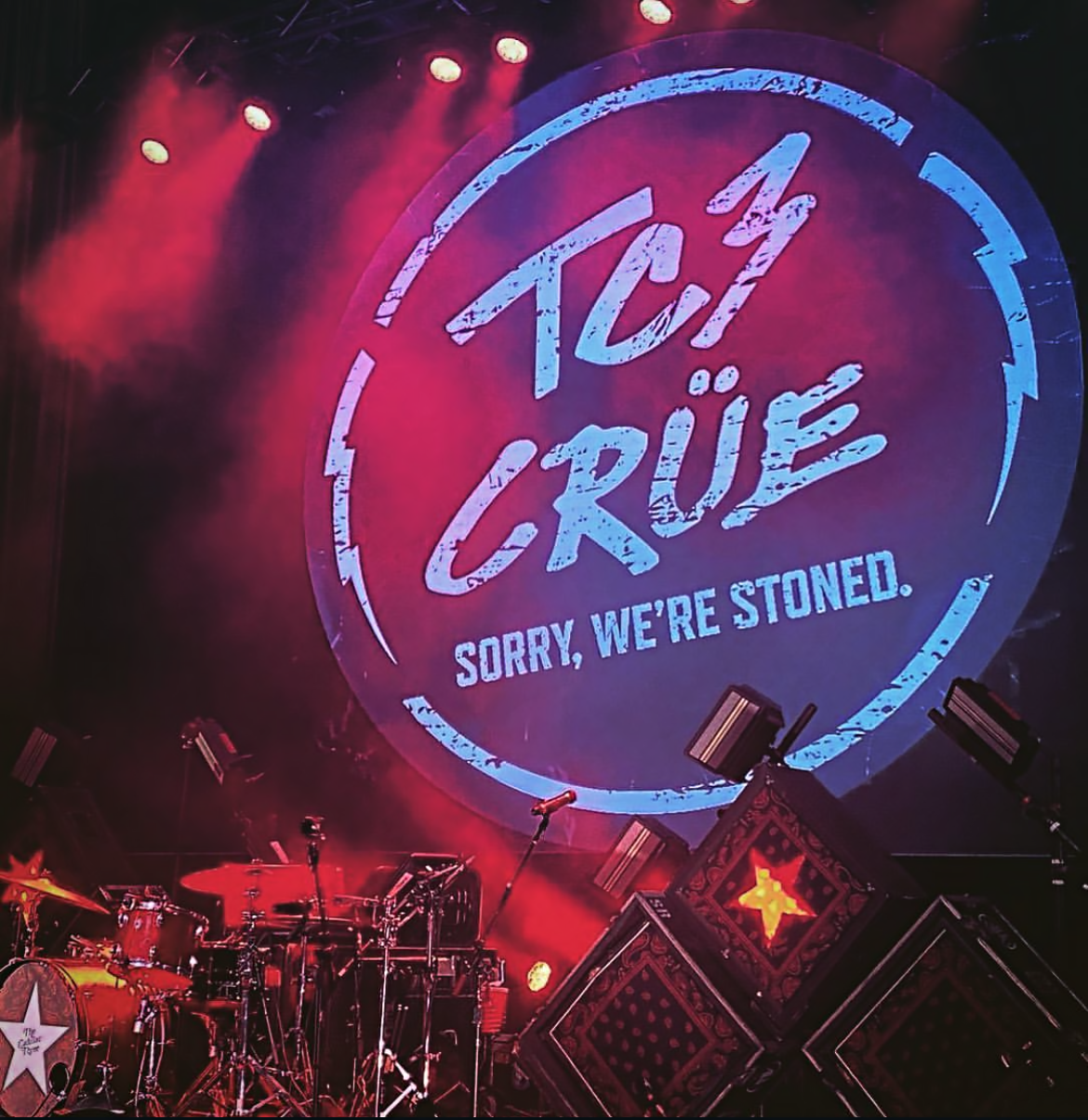 TC3 Crue logo on stage.PNG