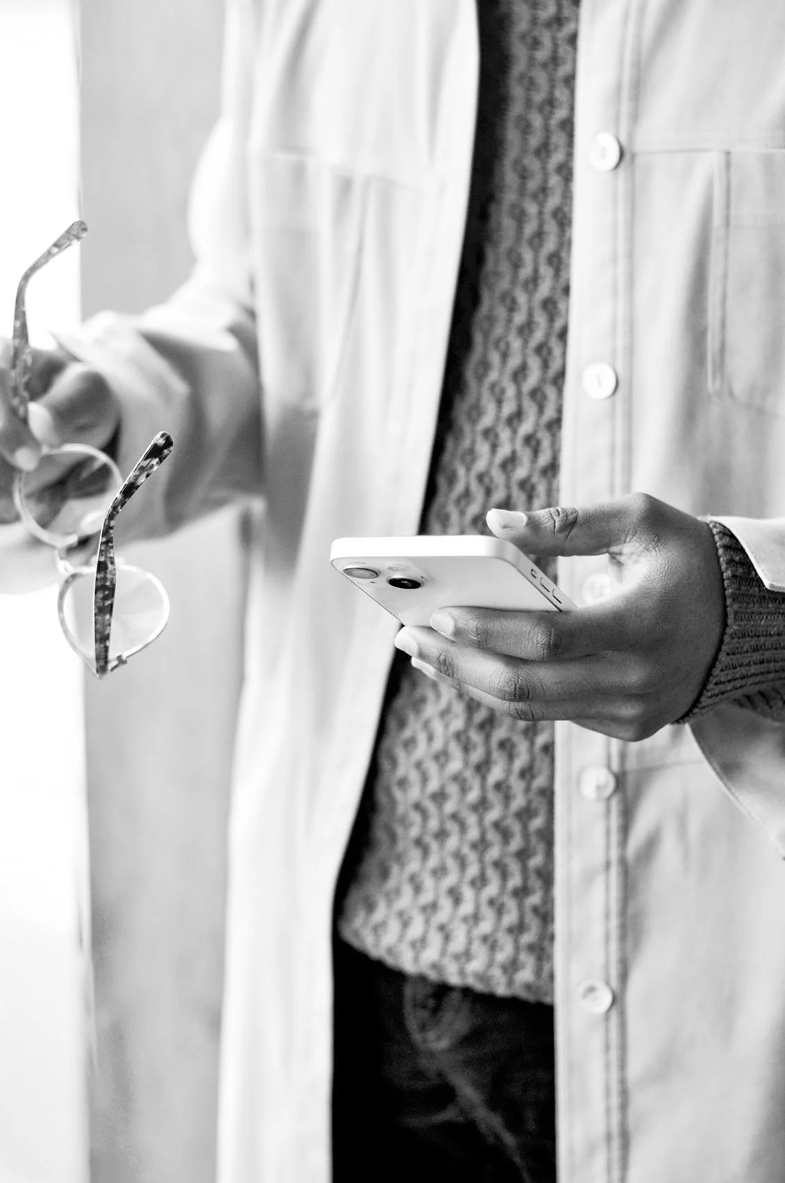 Sales compensation consultant reviewing incentive plan details on a mobile device.