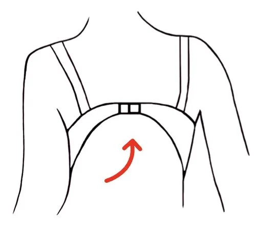 Line drawing of a person wearing a backpack with a red arrow indicating the direction upward.