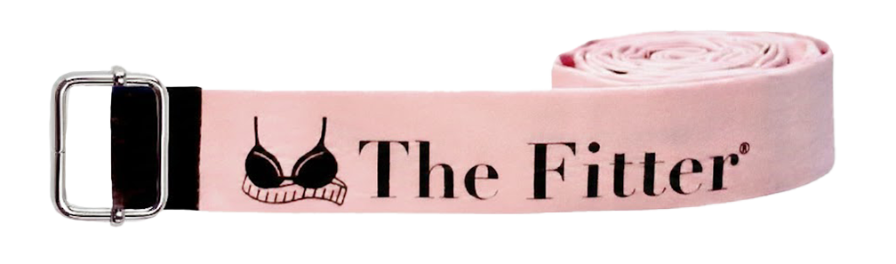 Pink fabric belt with black text reading "The Fitter" and a black bra illustration, laid flat with a metal buckle.