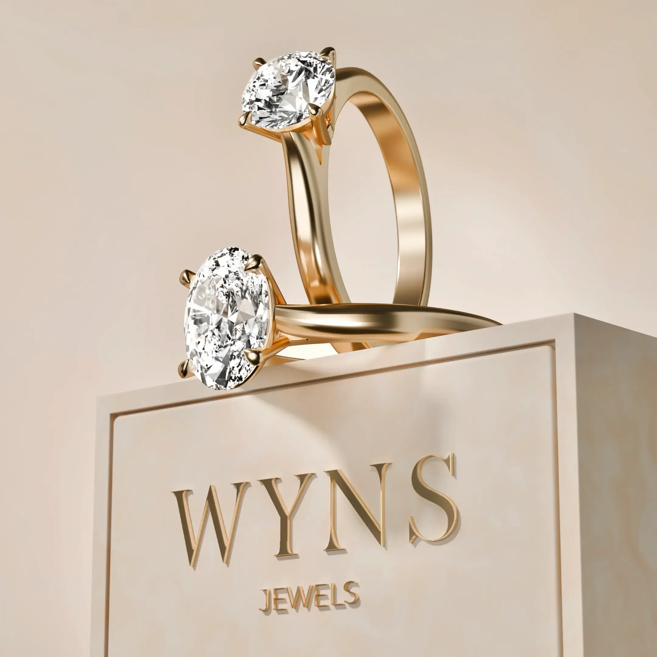 Two gold rings with large diamonds displayed on a platform with the brand name WYN'S.