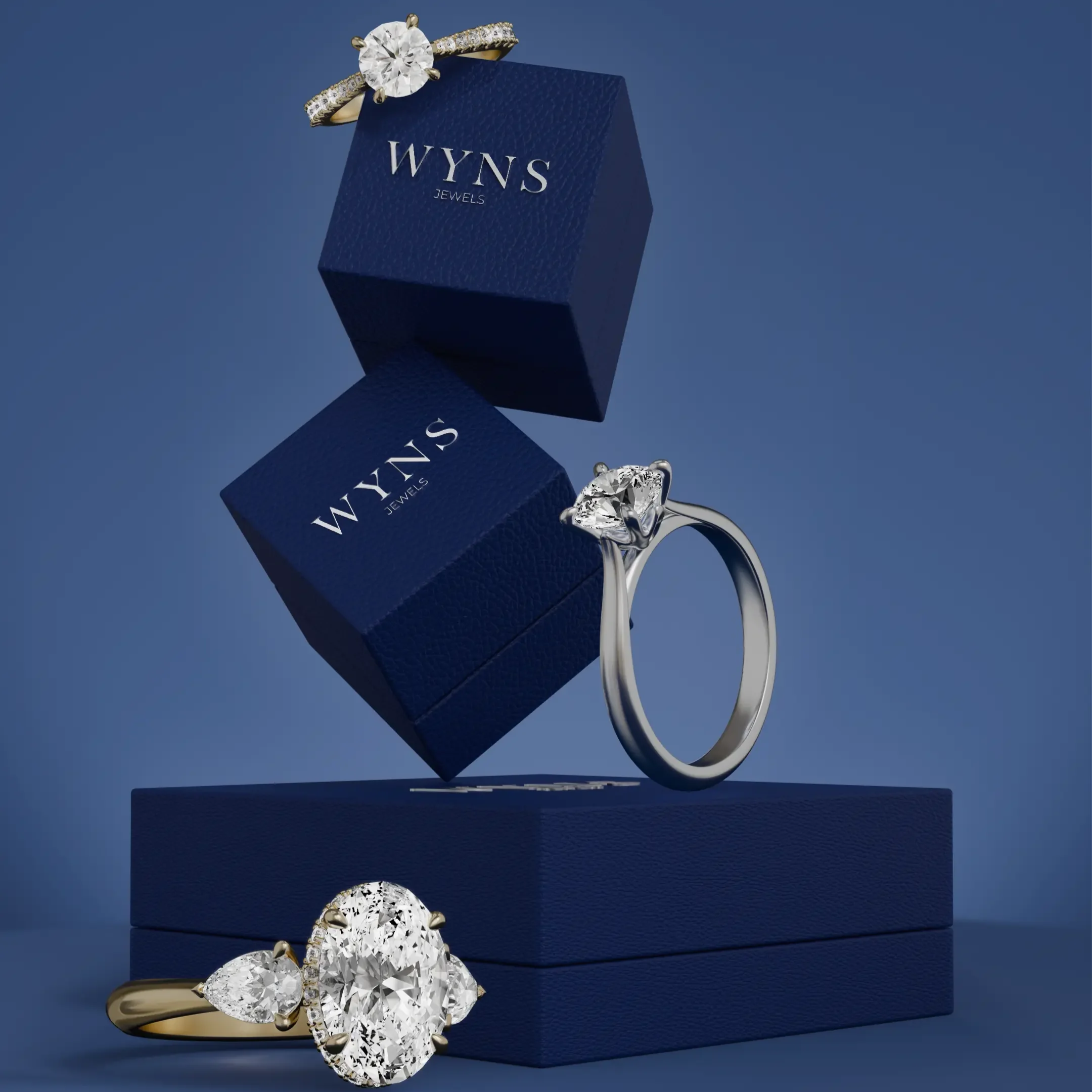 A diamond engagement ring and a diamond solitaire ring displayed with blue jewelry boxes labeled WYNS Jewels against a blue background.