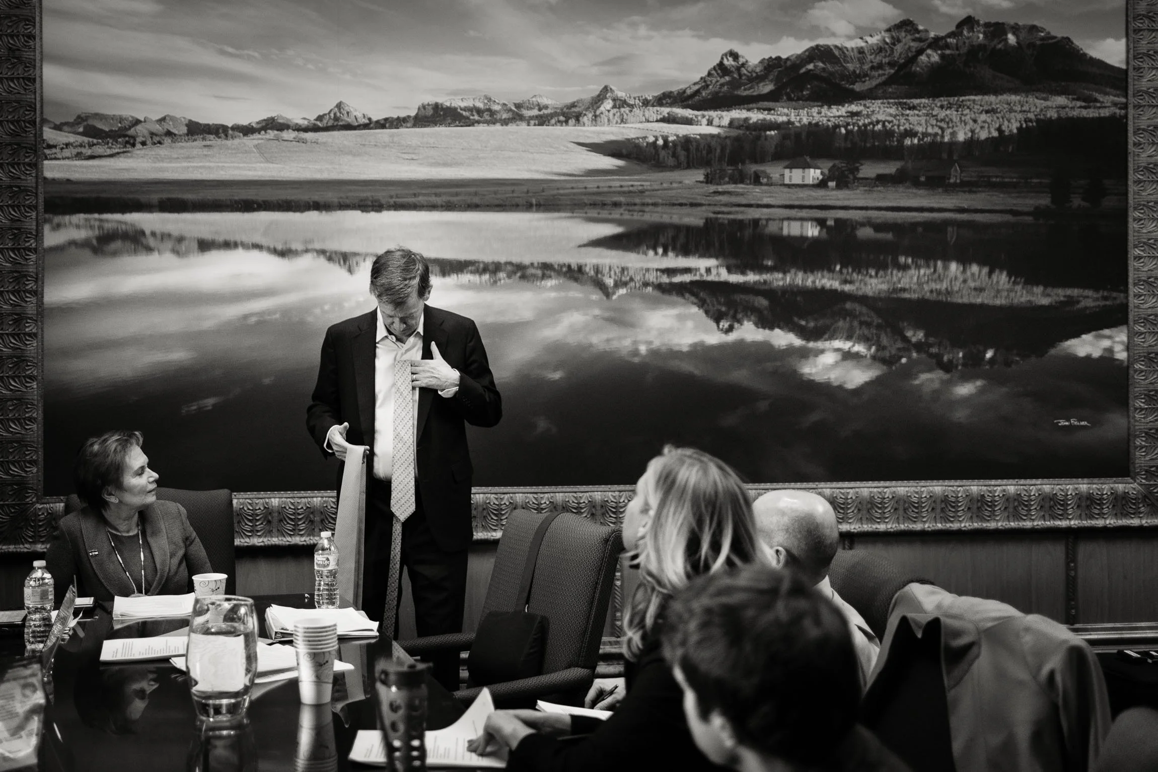 Governor John Hickenlooper  shows various ties to his staff, asking for suggestions before an important speech.