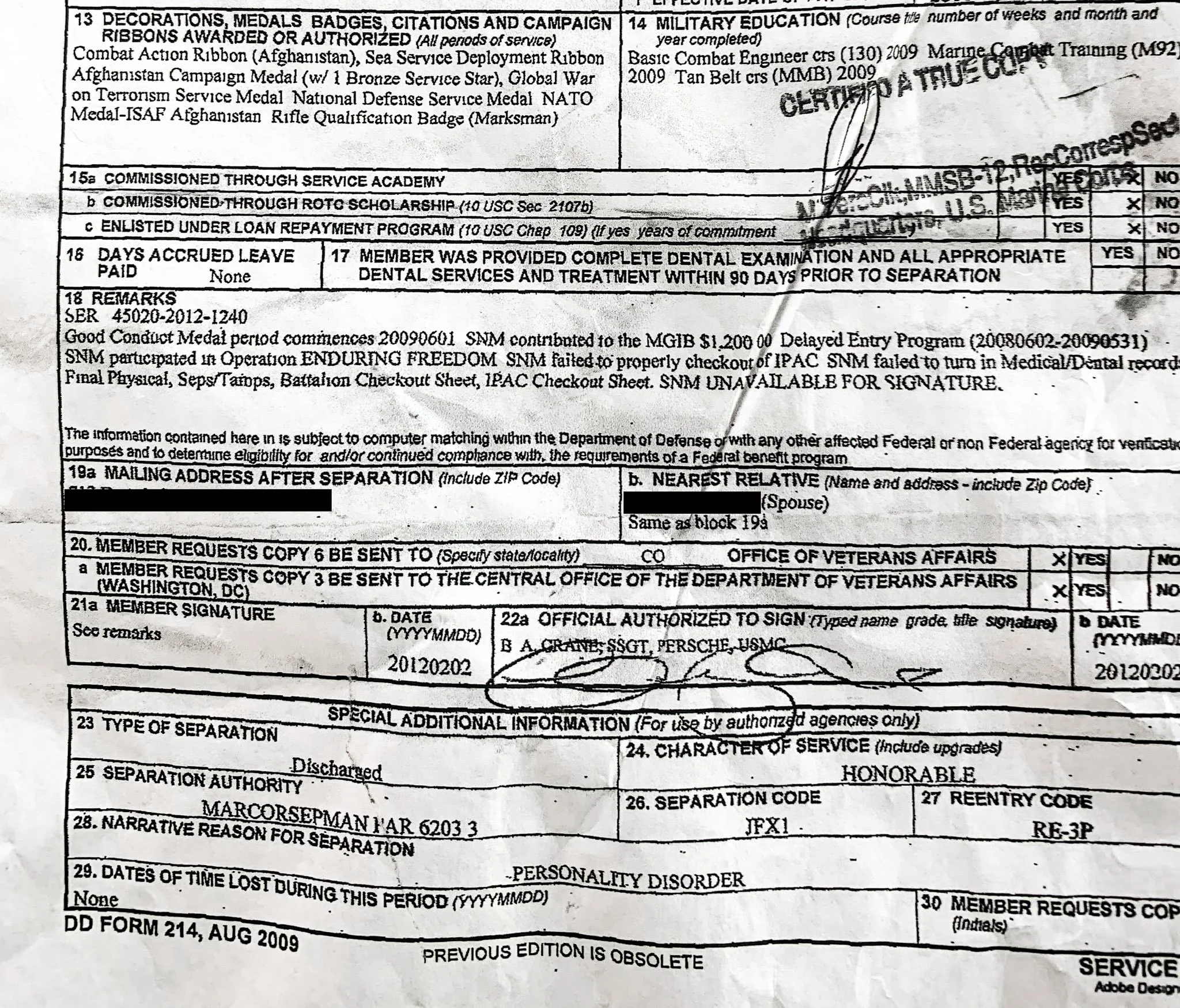Detail of a Marine's honorable discharge papers showing the cause of the discharge as a personality disorder.