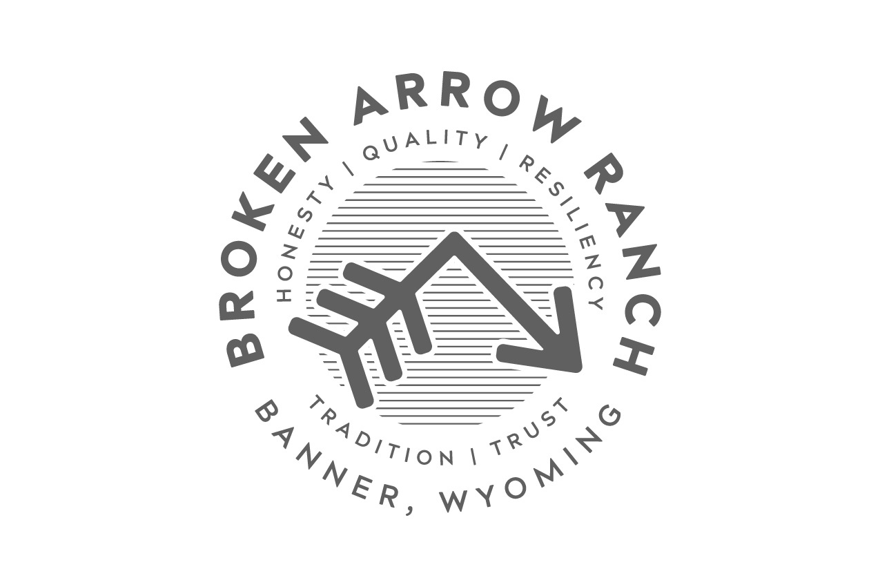 Logo for Broken Arrow Ranch featuring a stylized arrow with text around it, including business location and branding words.