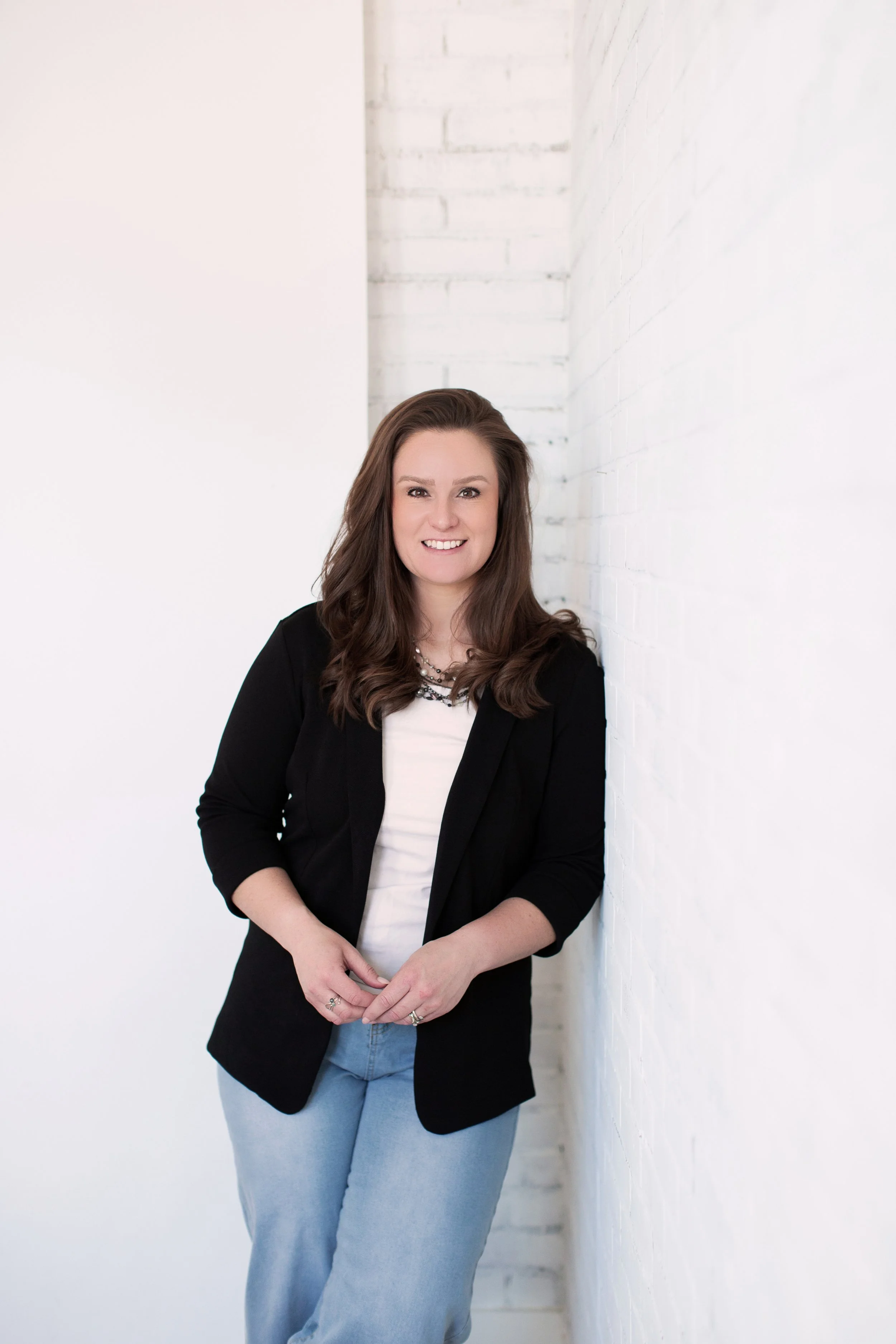 Professional studio headshot of Kristen Masters.