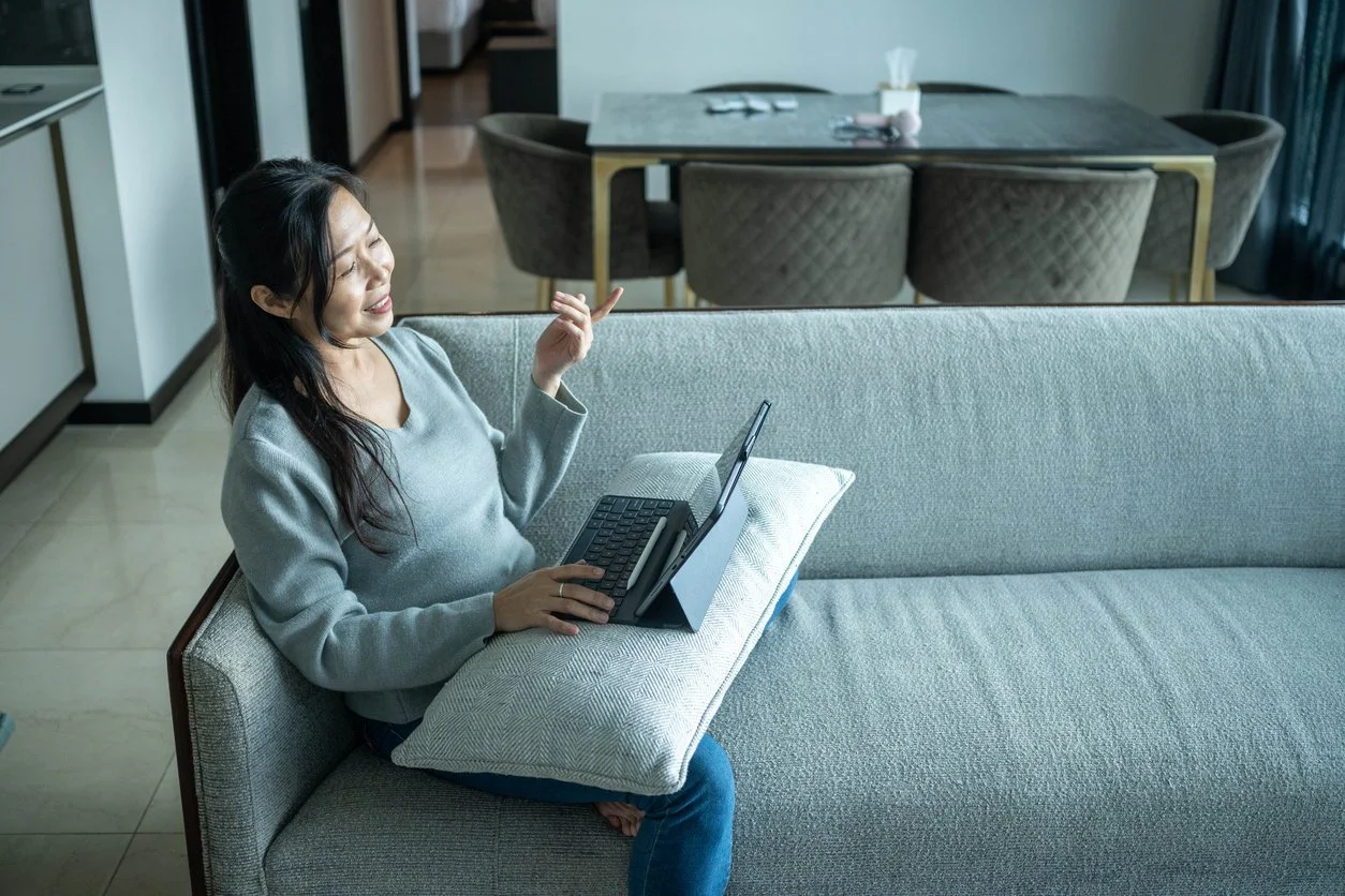 Woman suffering from chronic illness speaking with an executive function coach online for practical support