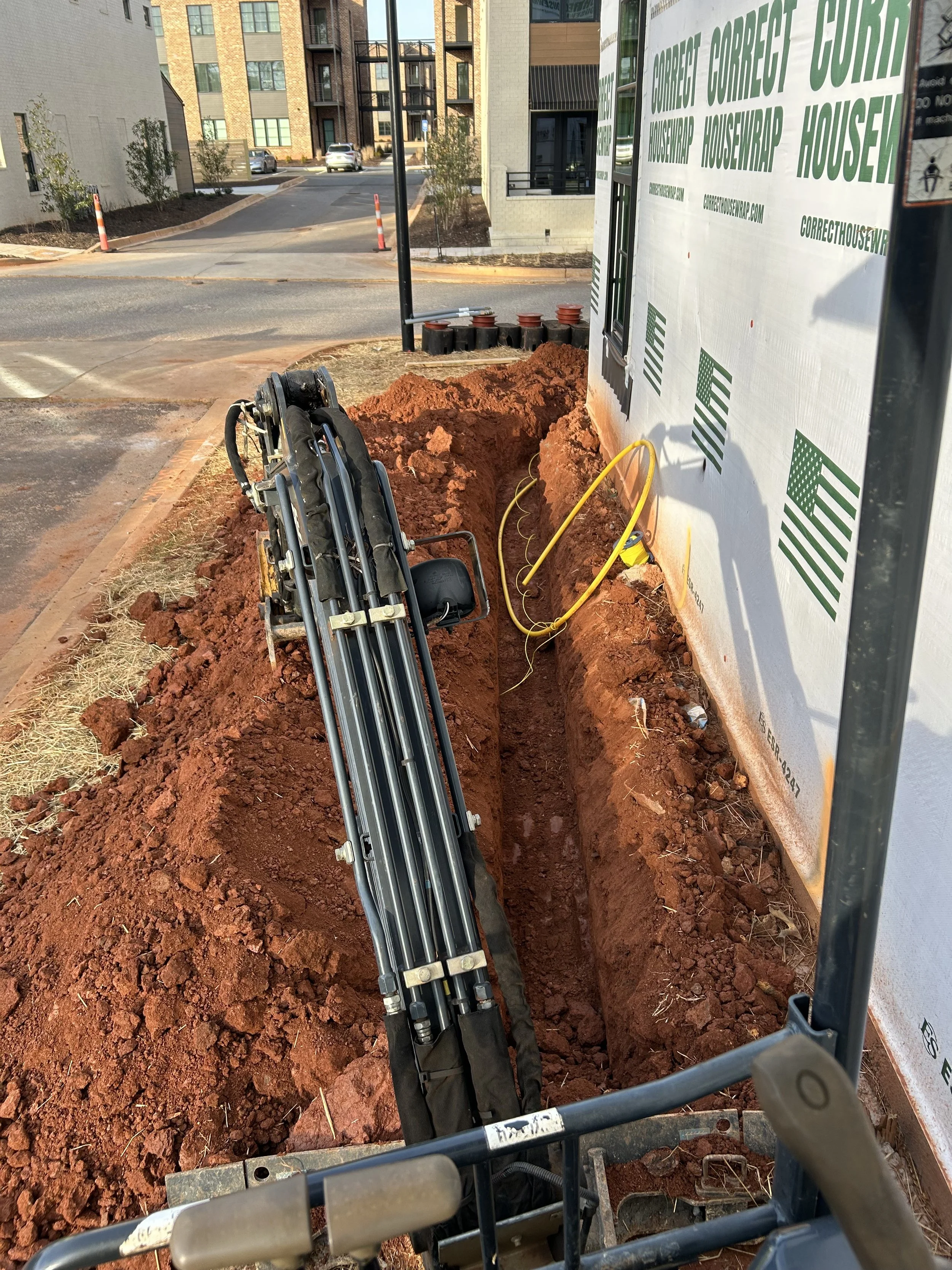 landscaping trenching excavation near me Hartwell georgia debris removal demolition pad site prep footers concrete drainage culverts French drain grading