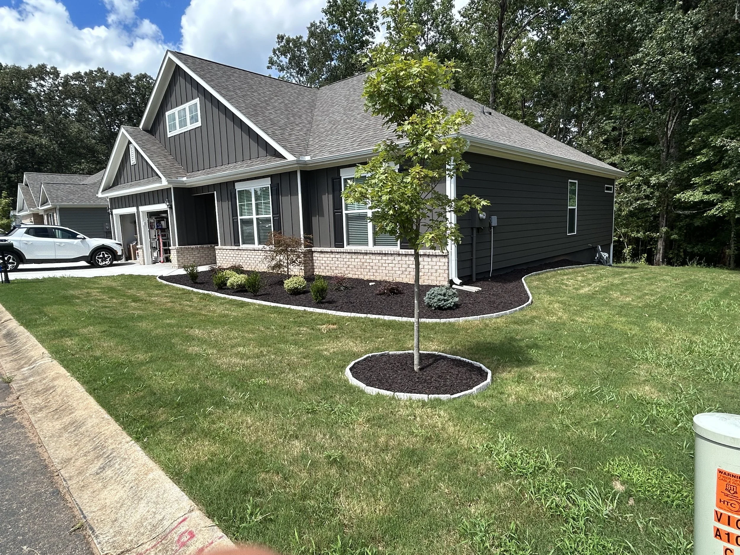 landscaping trenching excavation near me Hartwell georgia debris removal demolition pad site prep footers concrete drainage culverts French drain grading