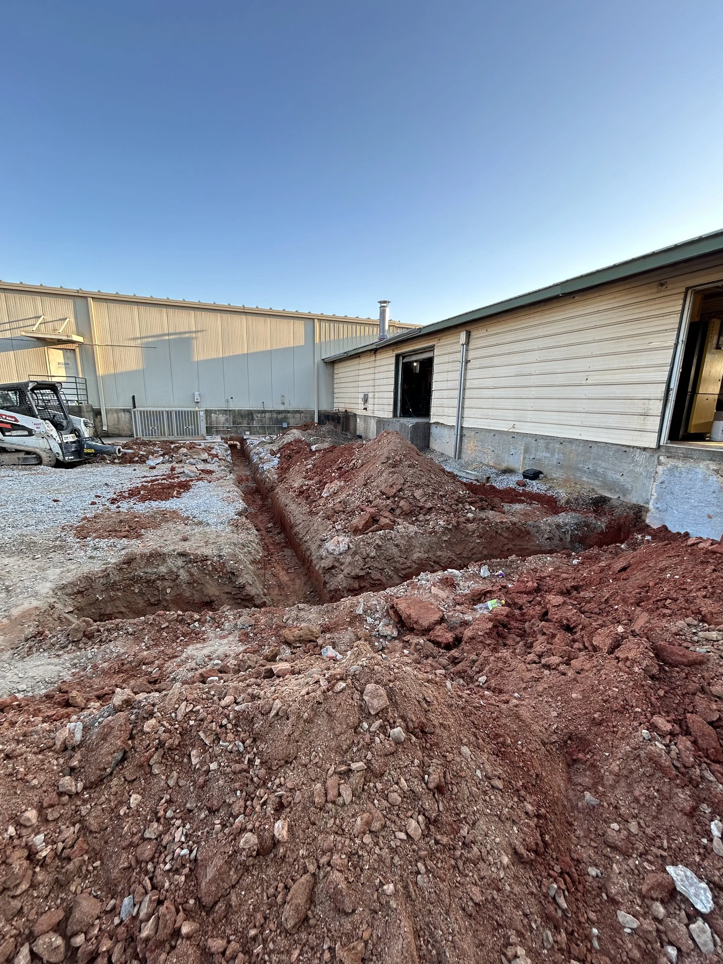 landscaping trenching excavation near me Hartwell georgia debris removal demolition pad site prep footers concrete drainage culverts French drain grading