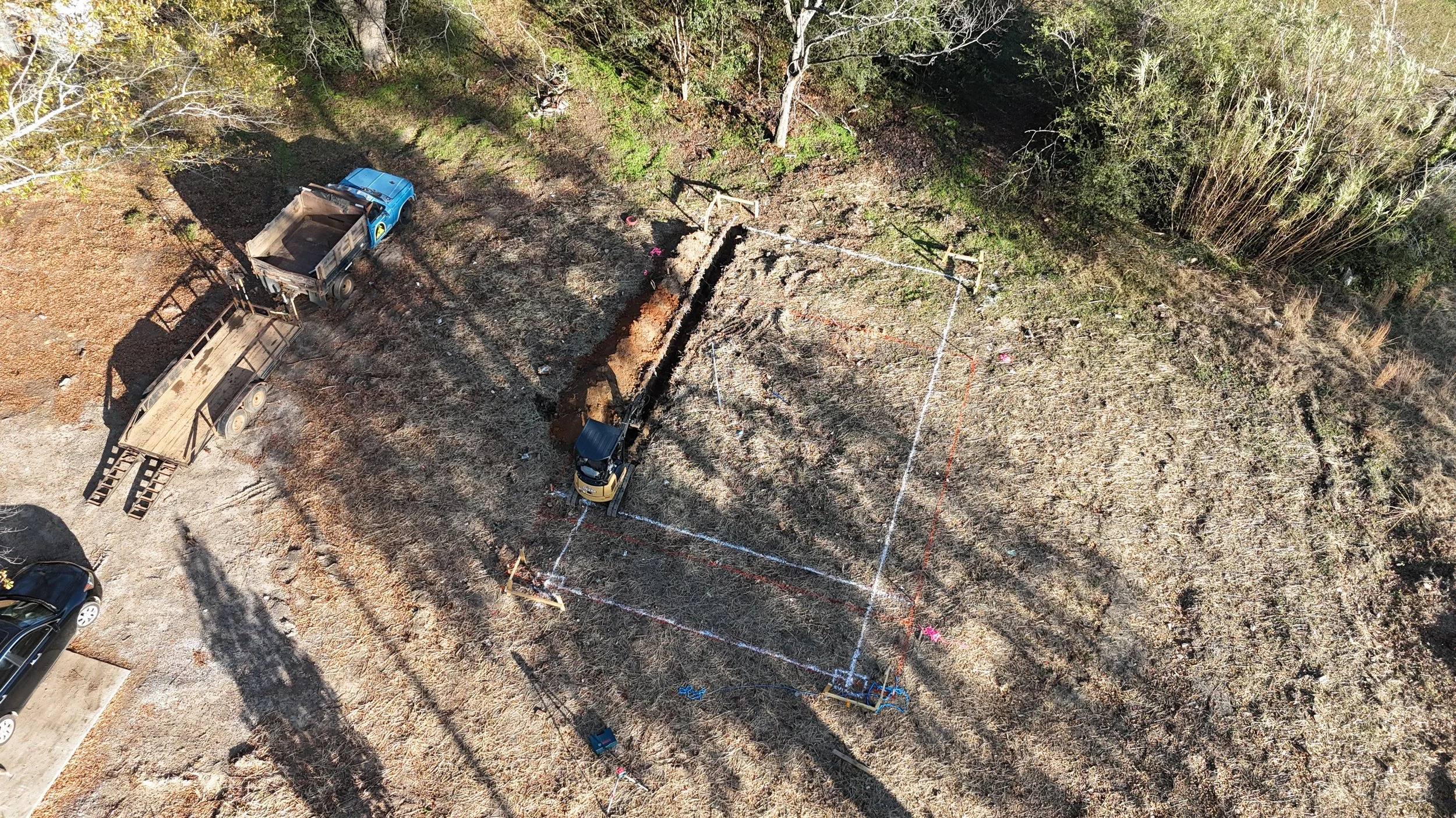 landscaping trenching excavation near me Hartwell georgia debris removal demolition pad site prep footers concrete drainage culverts French drain grading