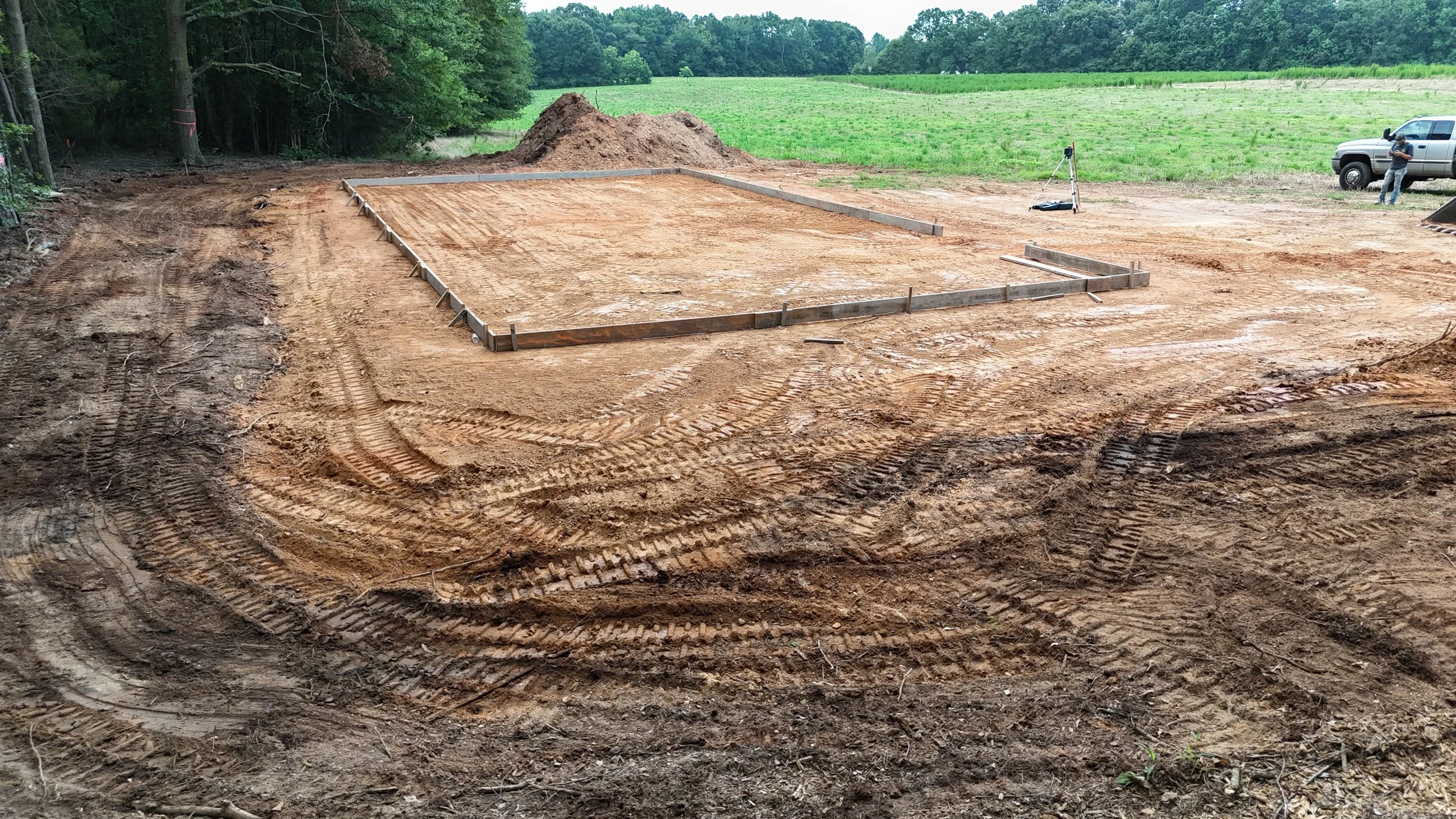 landscaping trenching excavation near me Hartwell georgia debris removal demolition pad site prep footers concrete drainage culverts French drain grading