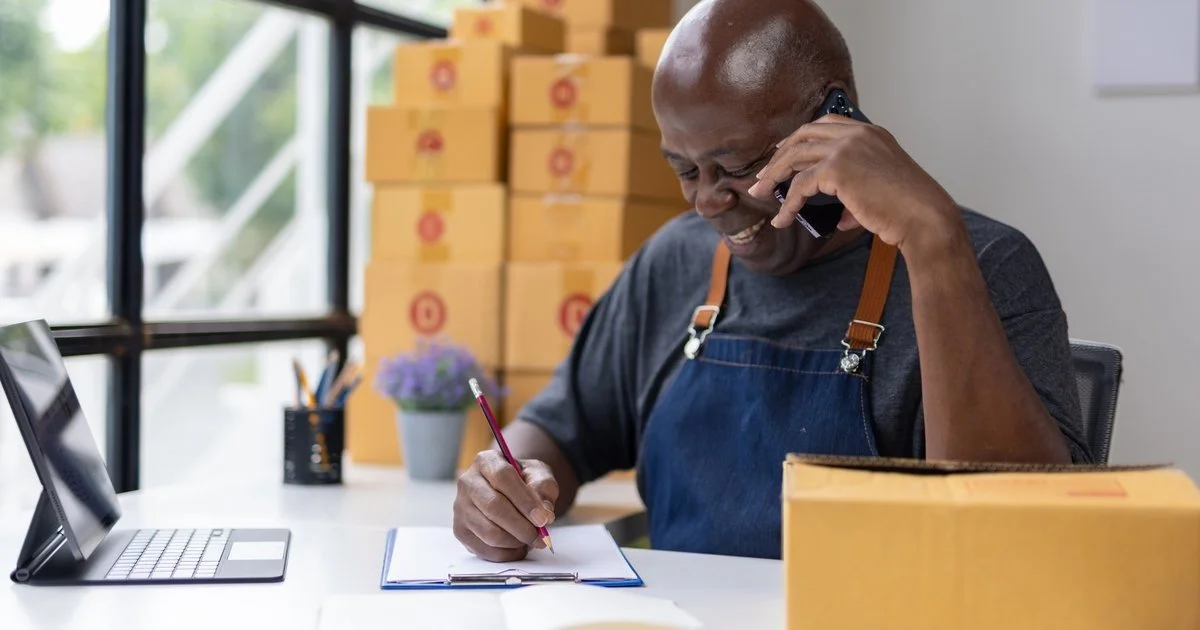 Veteran business owner reviewing a team operations plan in a professional workspace