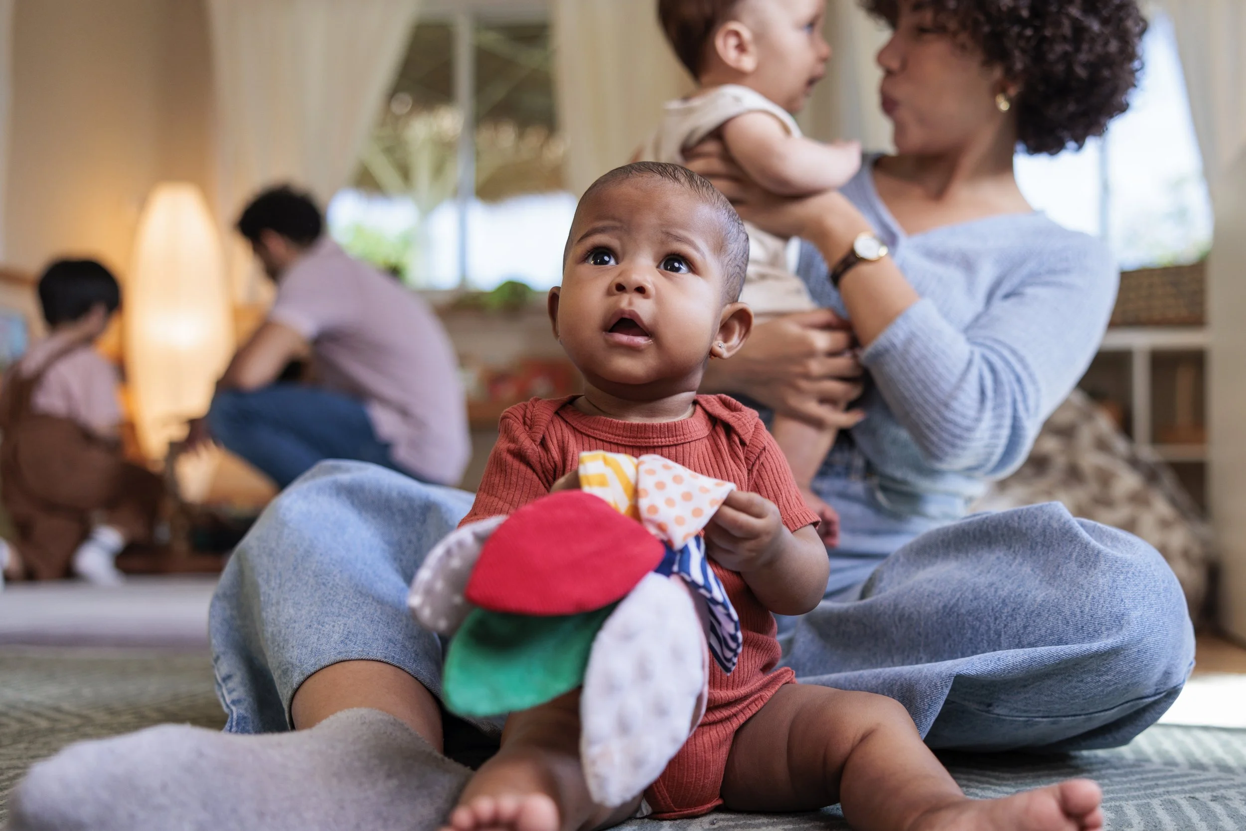 Baby playing with a fabric toy