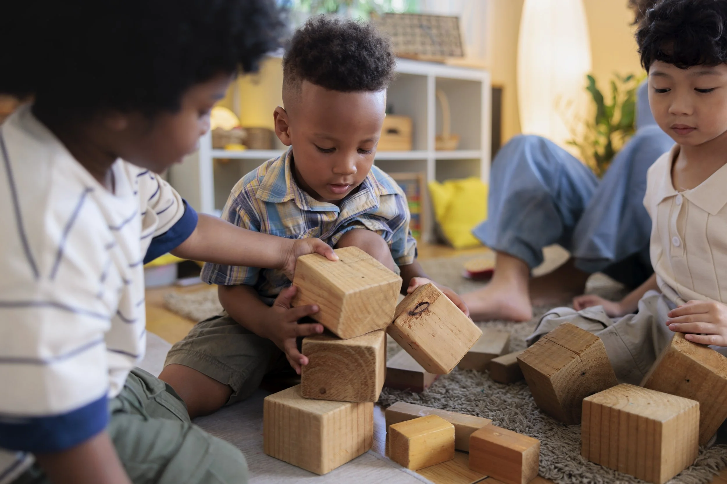Toddler playing with wooden blocks at daycare