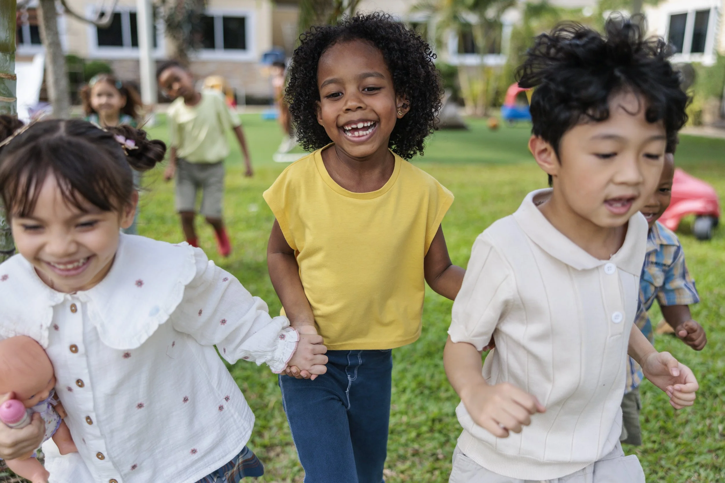 Group of young kids playing outside at daycare