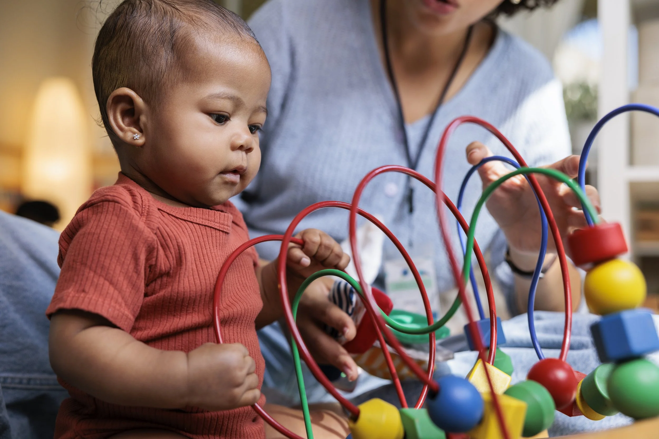 Baby playing with a toy