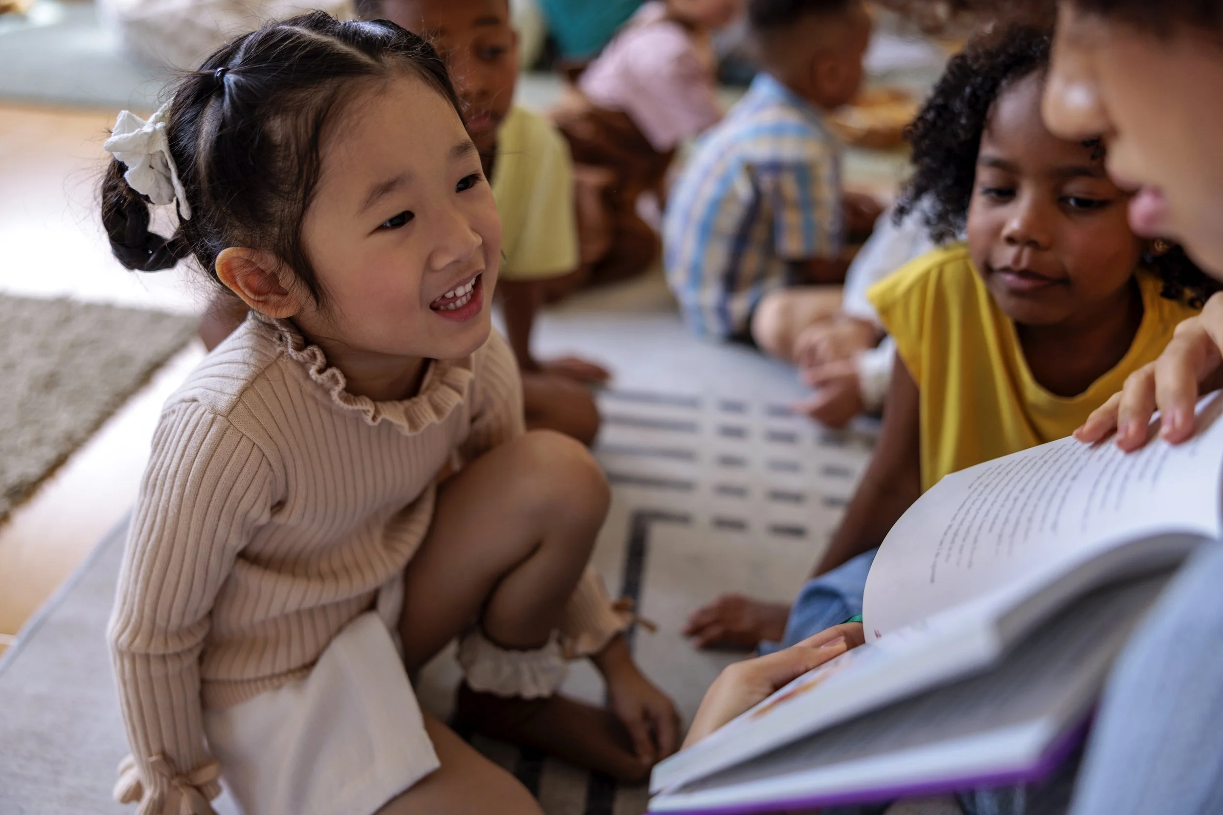Daycare teacher reading to students