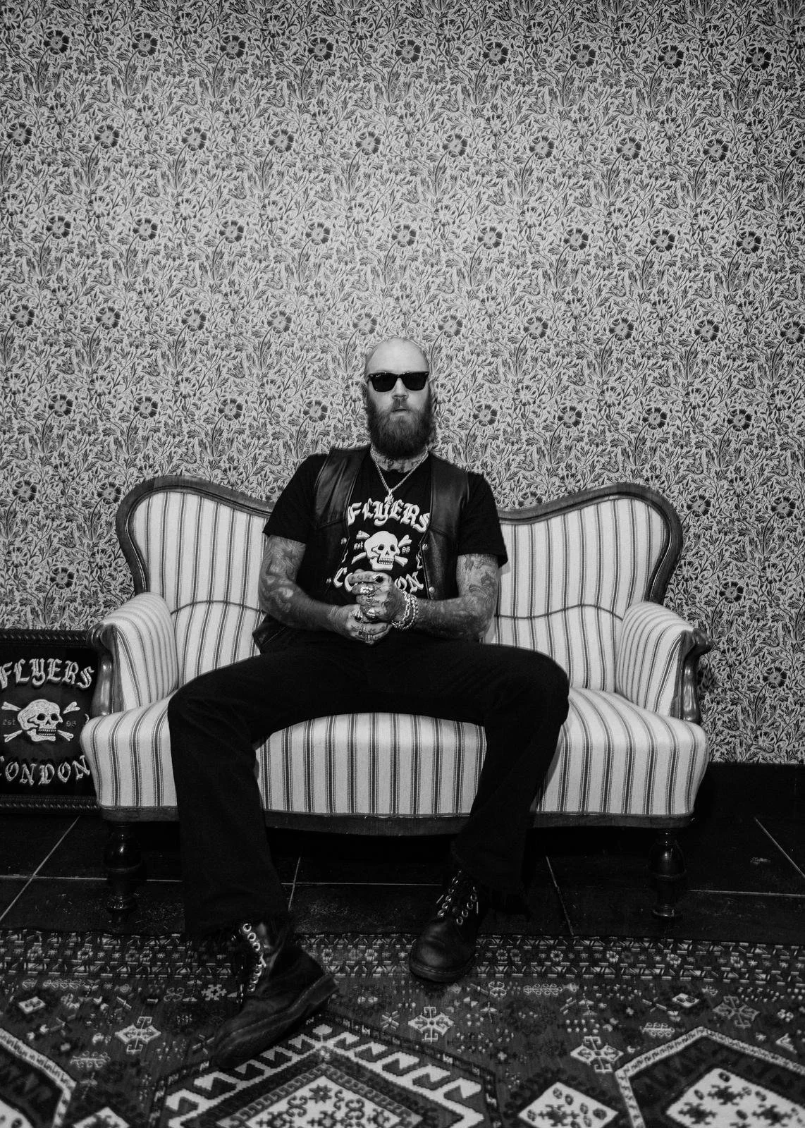 A man wearing a flyers london tshirt