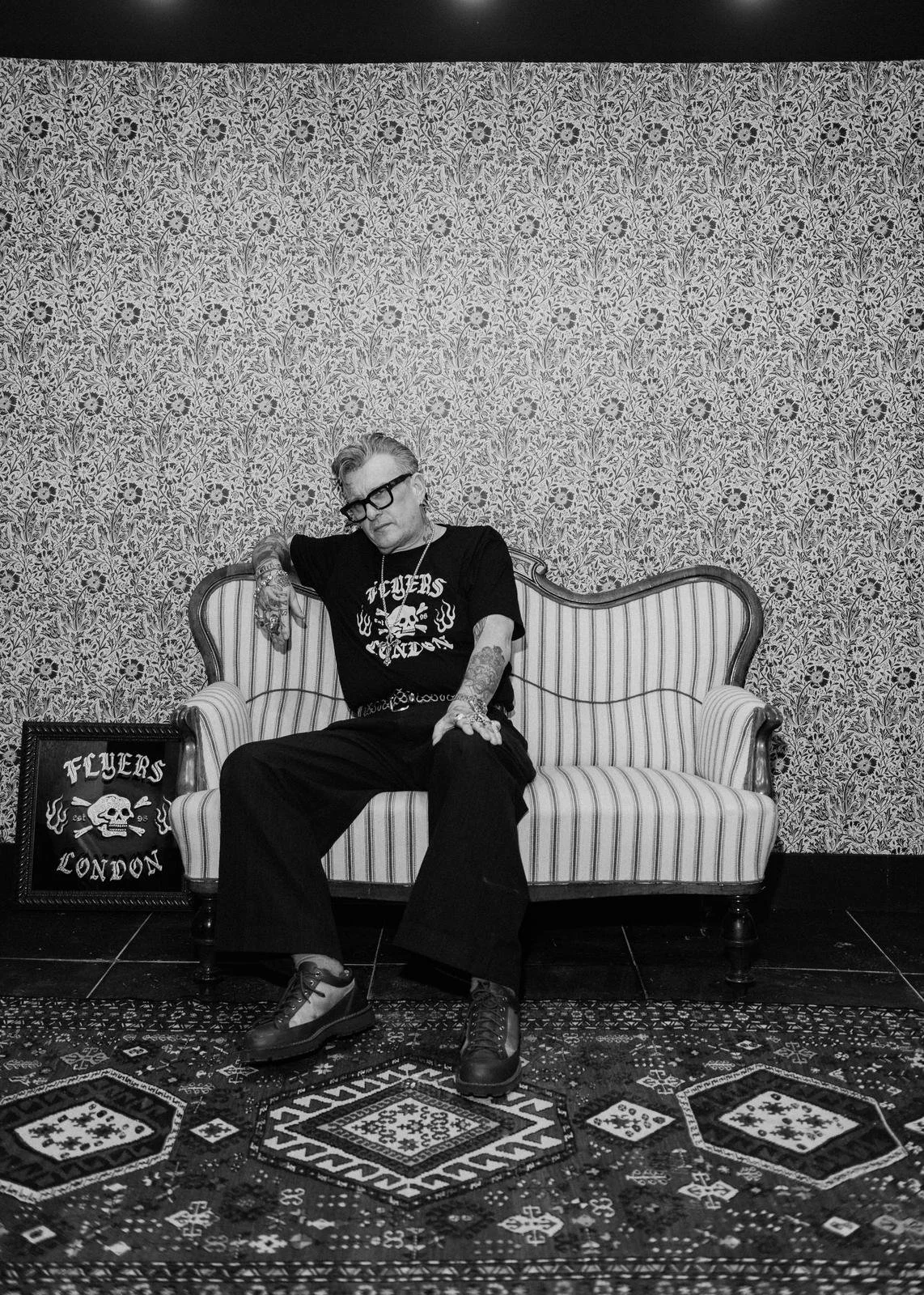 A man wearing a flyers london tshirt