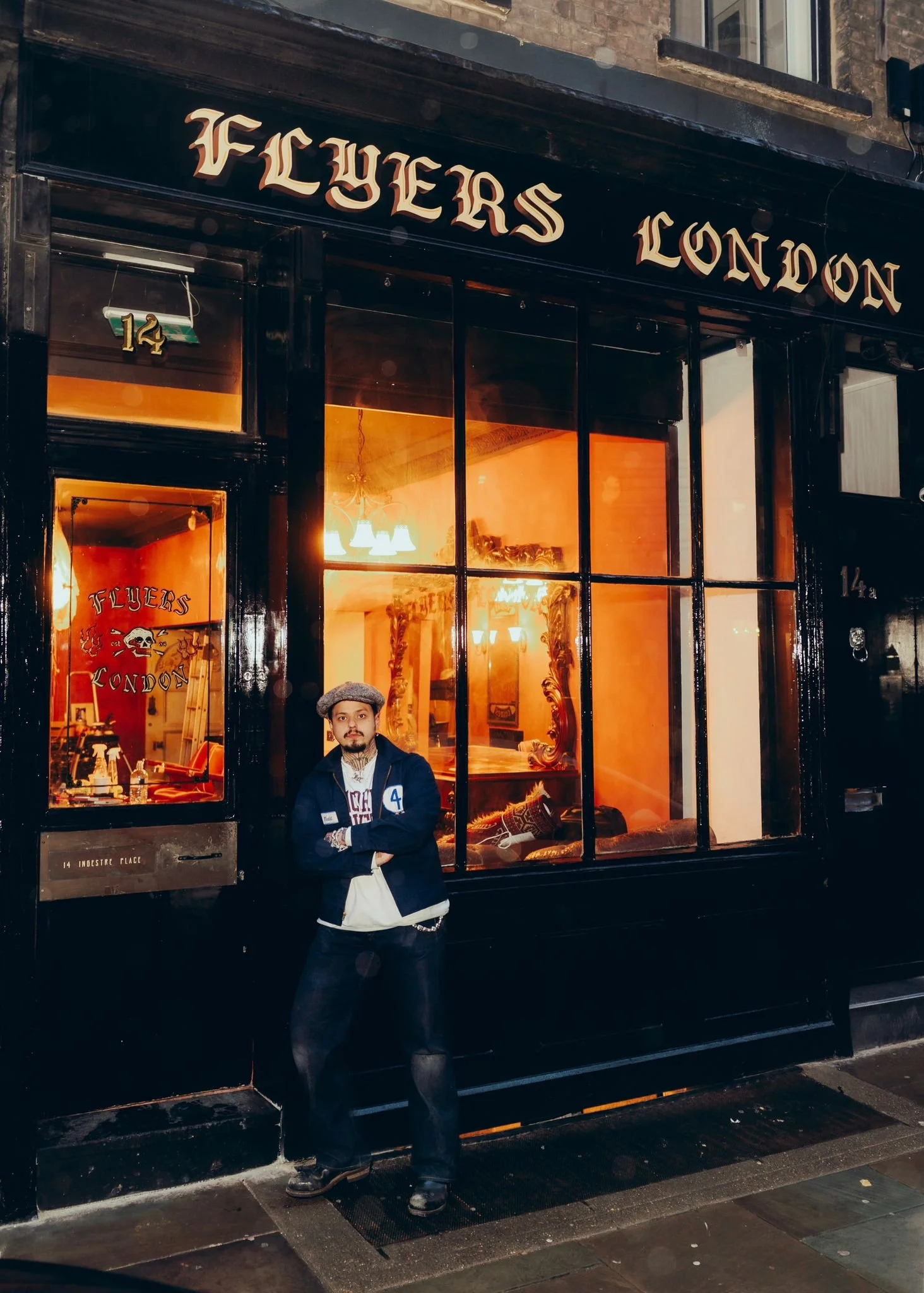 Ryan, owner of Flyers London, stood outside the barbershop