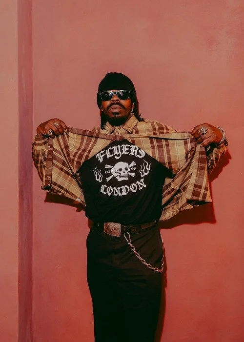 A man wearing a flyers london t-shirt