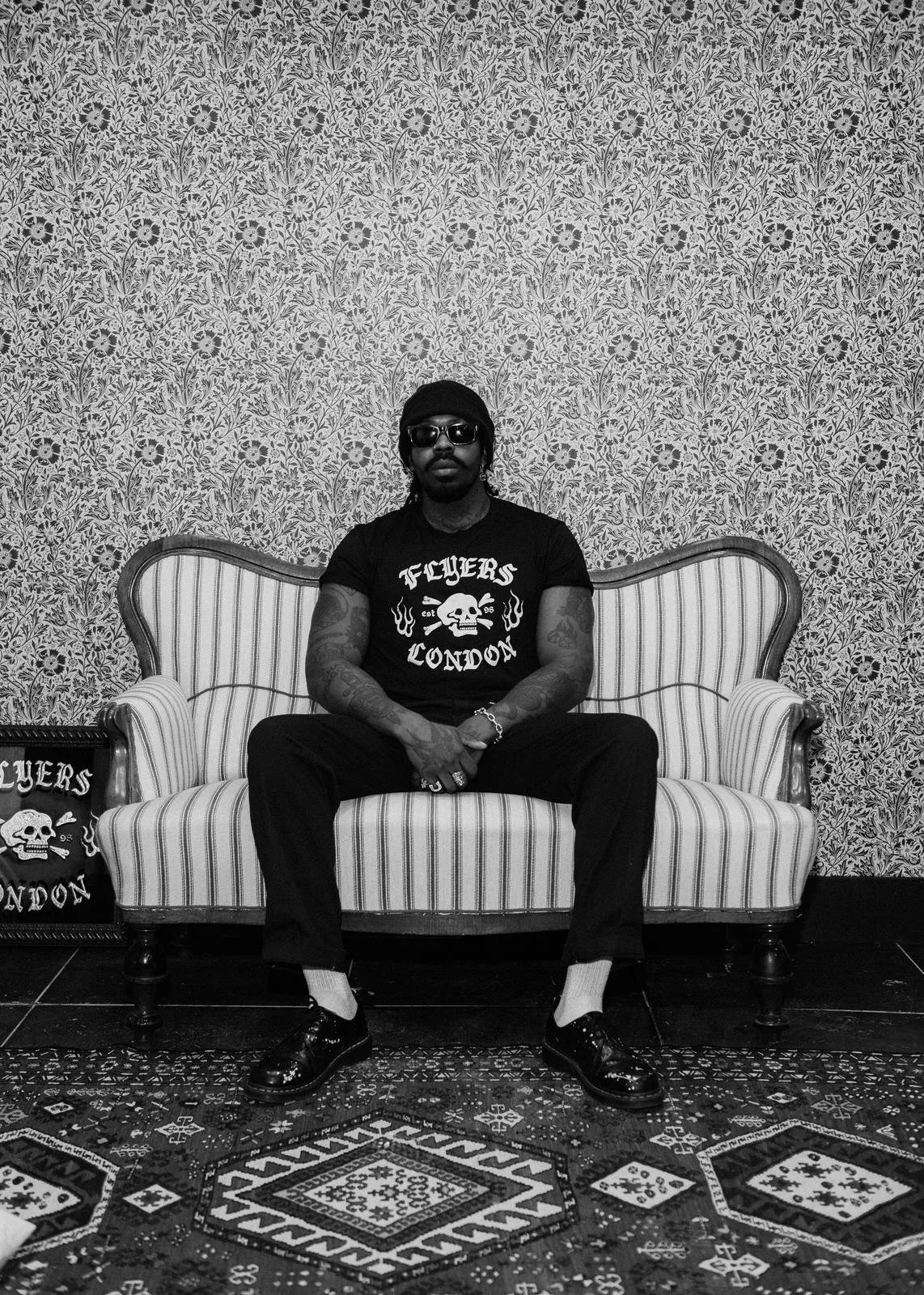 A man wearing a flyers london tshirt