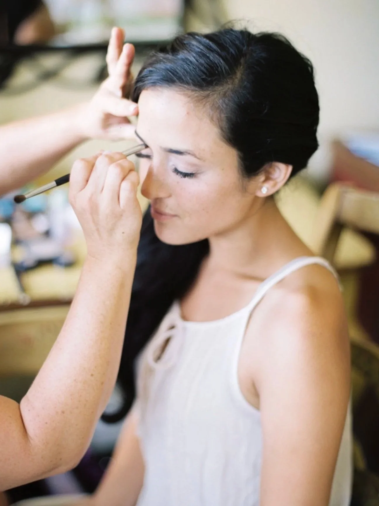 Woman getting her makeup done by professional makeup artist located in Salem, OR