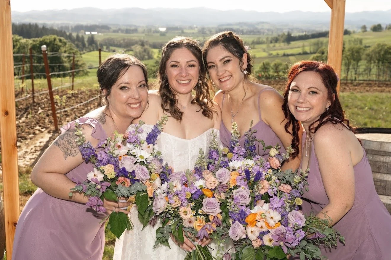 Bride and Maids for outdoor wedding party. Posting at a vineyard with their bouquets. Professional makeup for all four ladies done by Ali Bell of Bell Sol Beauty & Esthetics in Salem, OR.