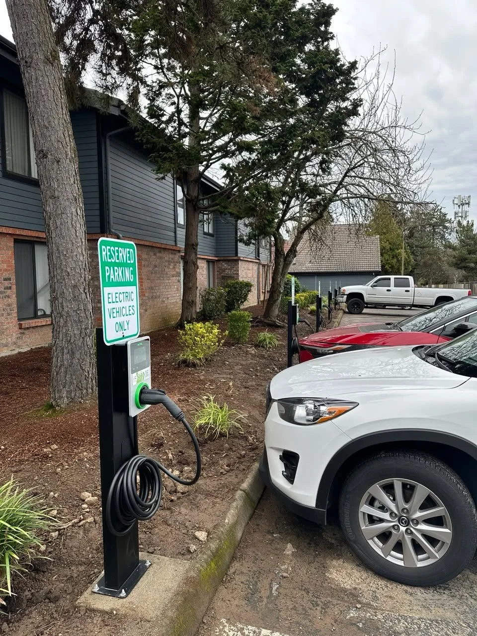 A little behind the scenes of a job we finished today. 
Installed 12 new EV chargers at an apartment complex in Tigard, Oregon.
From start to finish&mdash;digging, trenching electrical load calculations, and final install&mdash;we handled it all.

Is