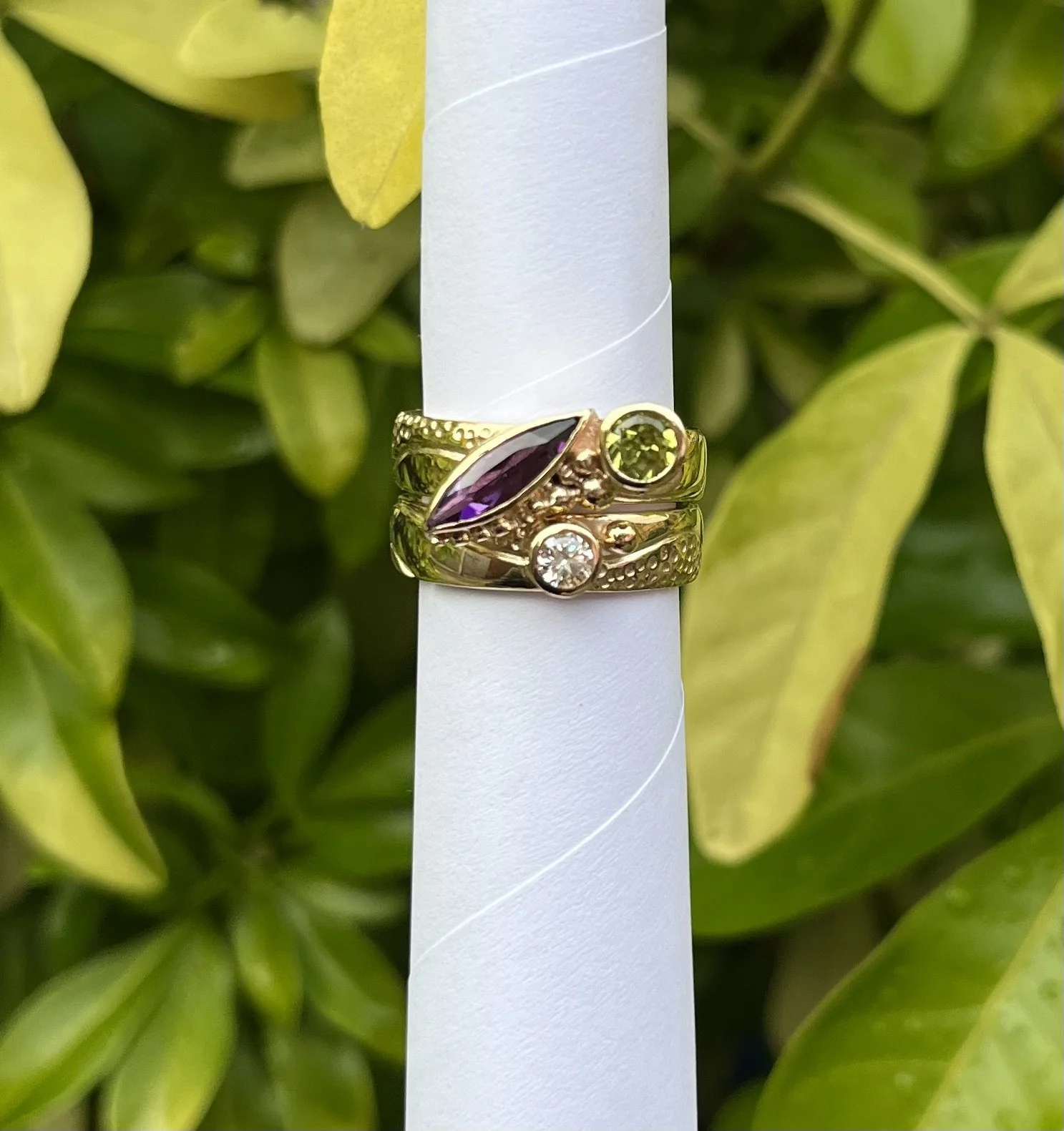 Jacqueline warrington.+Gold,+amethyst,+peridot+and+diamond+interlocking+rin..jpeg