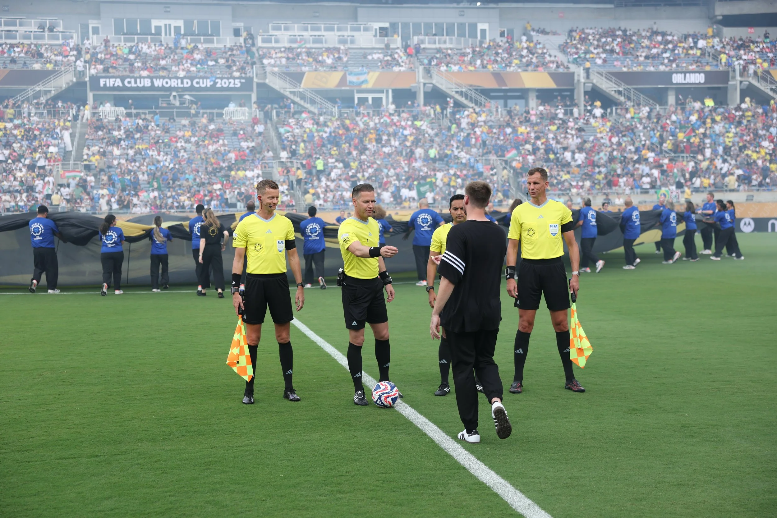 chummys customs delivering coin as coca-cola offical coin toss assistant ahead of fifa club world cup quaterfinal