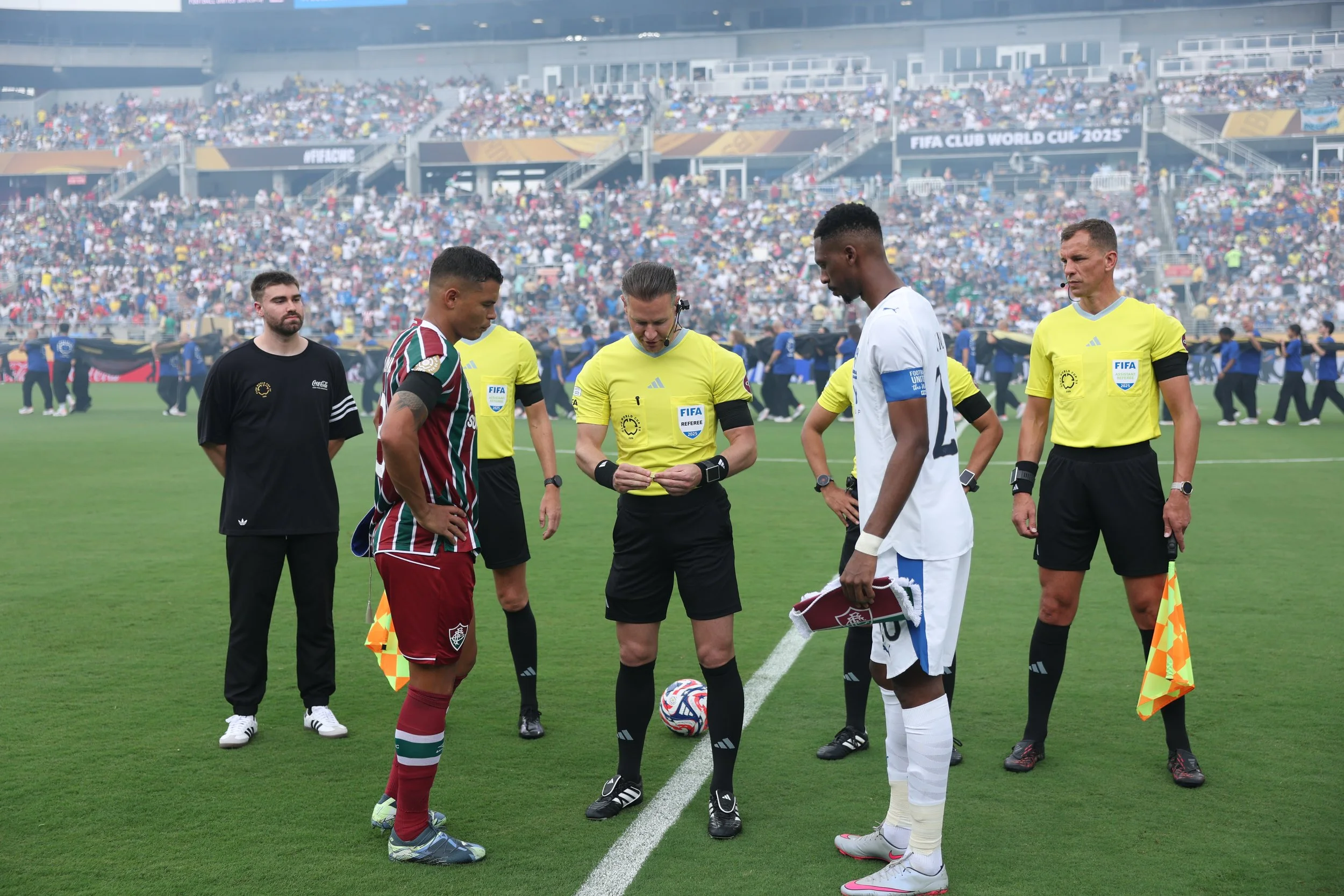 chummys customs next to refs and team captains coca-cola offical coin toss assistant ahead of fifa club world cup quaterfinal