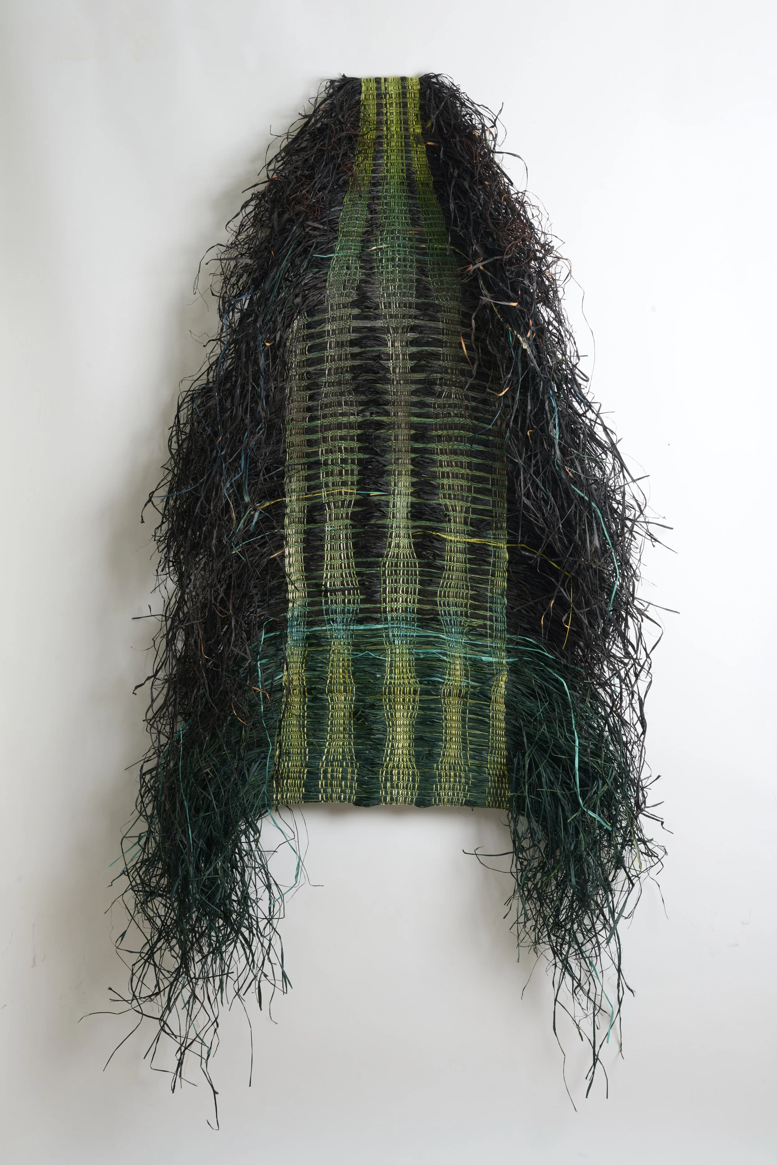 “Shield Black Green”, Cotton / Raffia, 40x49 inches, 2025.