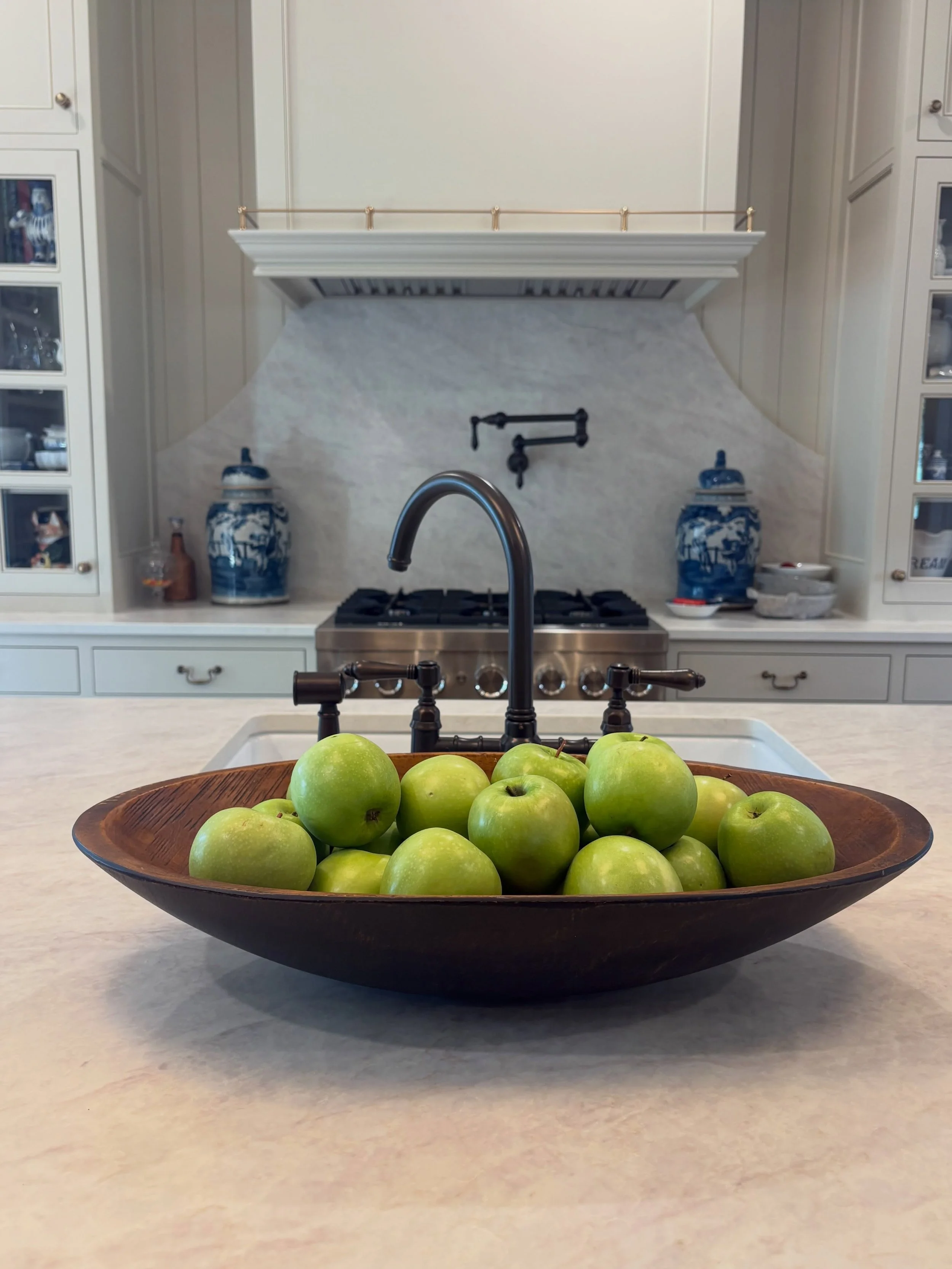 The custom cabinetry, framed glass-front doors, beautifully proportioned range hood, integrated pot filler, and carefully considered hardware were all designed to feel as though they belong exactly where they are.

It&rsquo;s the little details&mdash