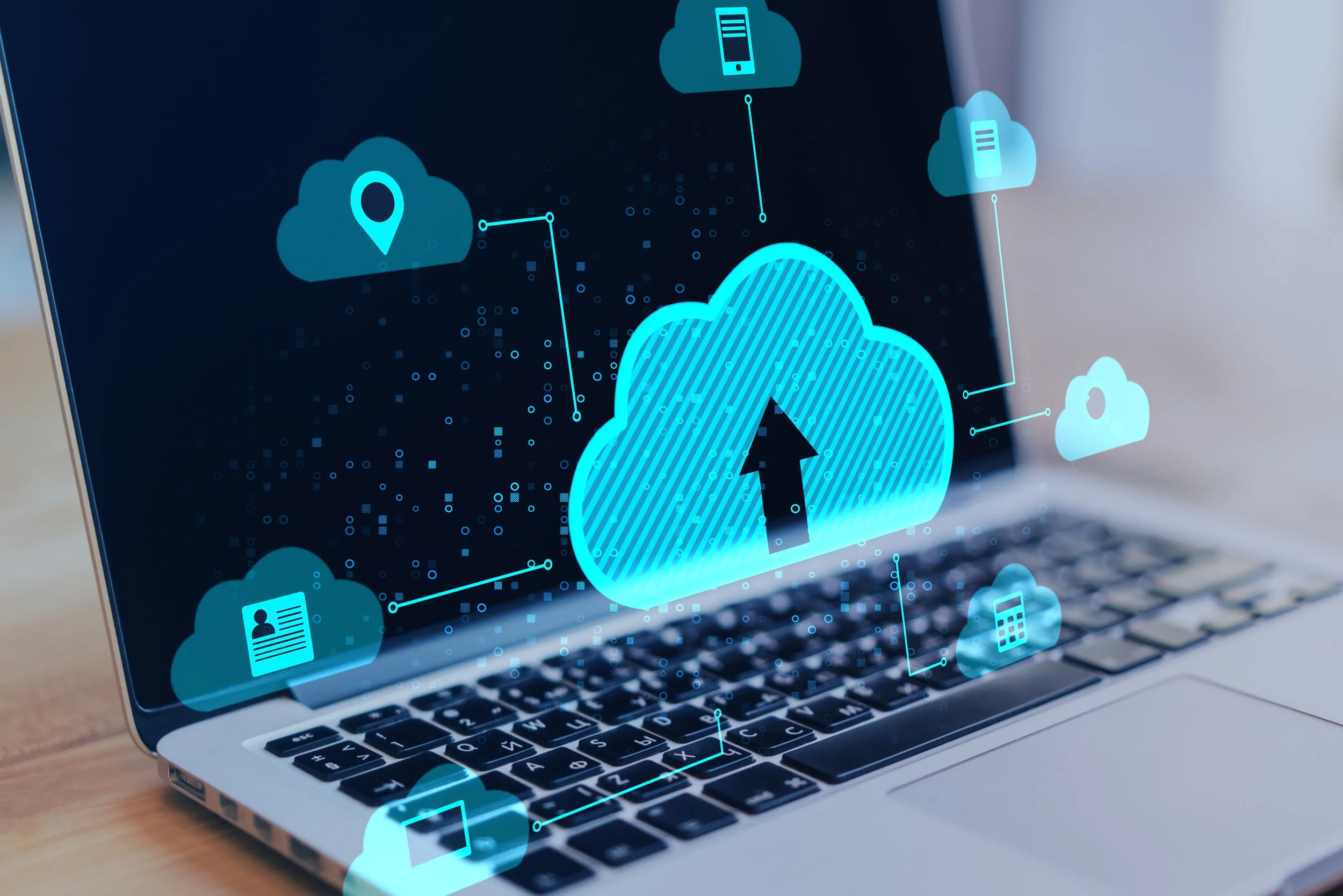 Digital illustration of a cloud with an upward arrow, surrounded by icons representing cloud storage, documents, location, and devices, on a laptop screen.