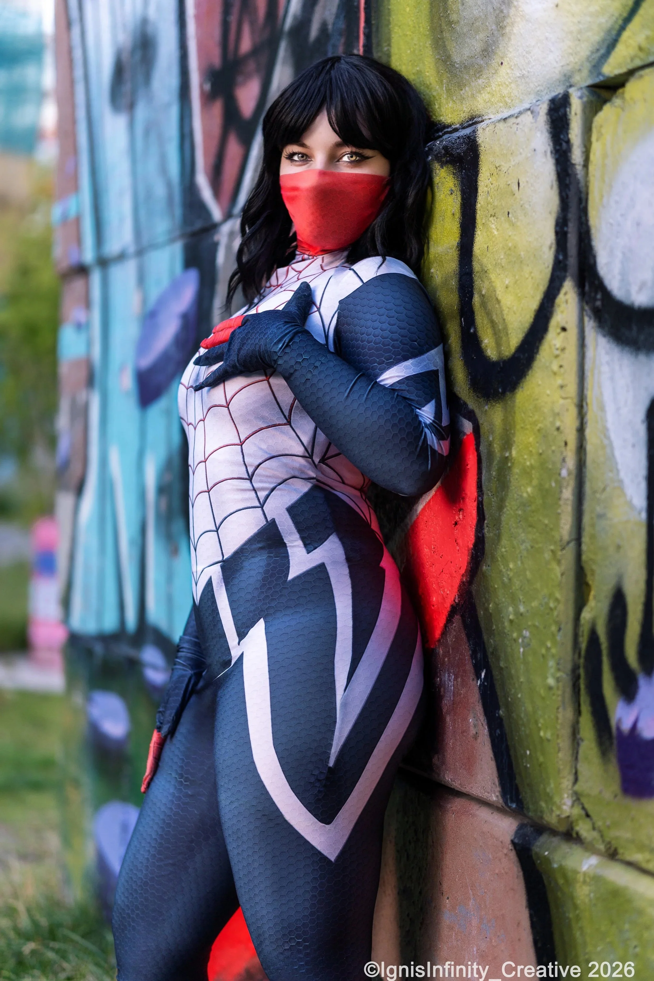 Silk (Cindy Moon) Marvel cosplay leaning against colorful graffiti wall in Utrecht, Netherlands – professional cosplay photography by Rotterdam photographer IgnisInfinity Creative