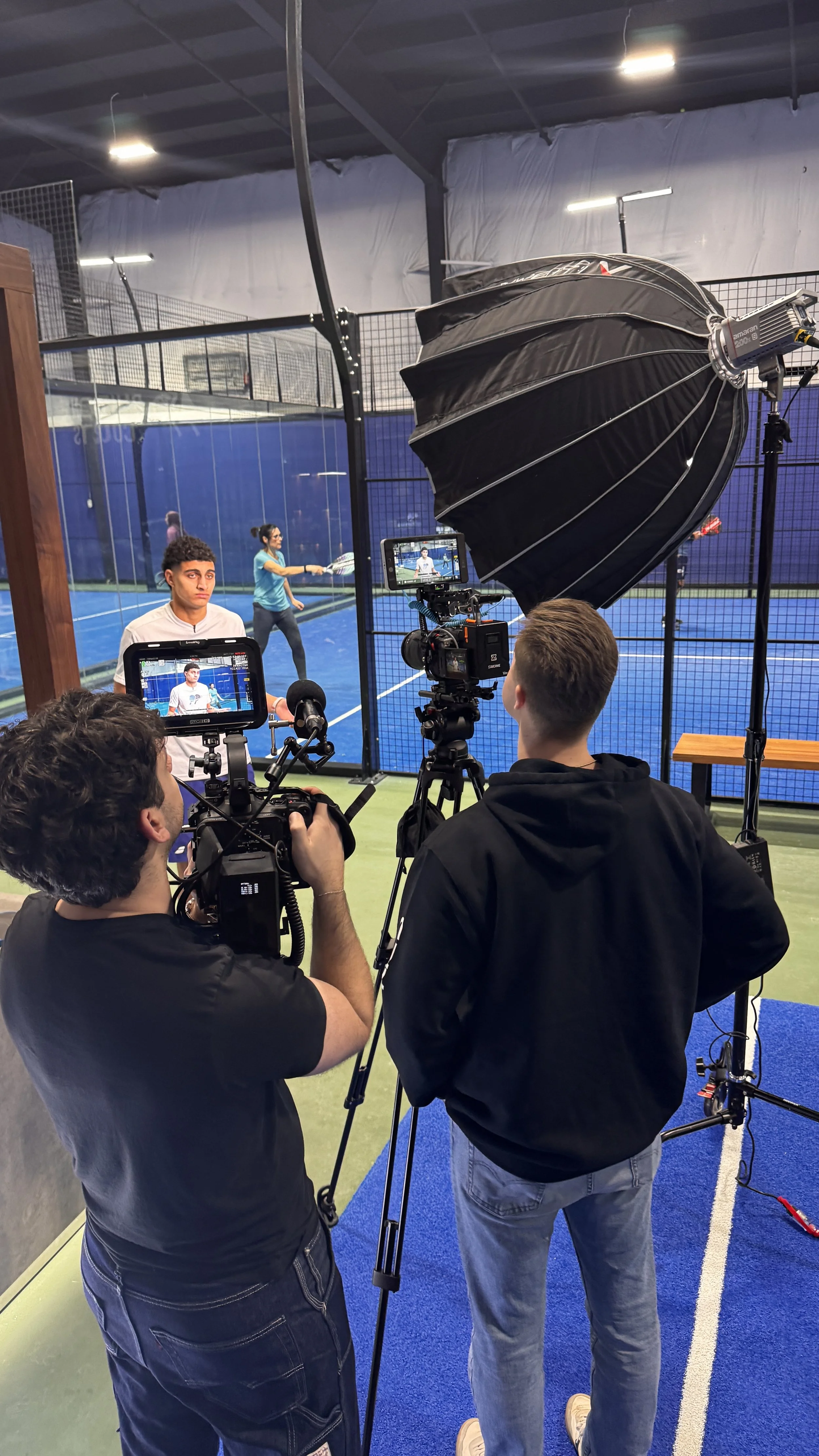 Behind-the-scenes at a Deadline Creative videography production featuring professional filming equipment, cinematic lighting, and branded sports content creation at Blue Zone Courts in Burlington, Ontario.