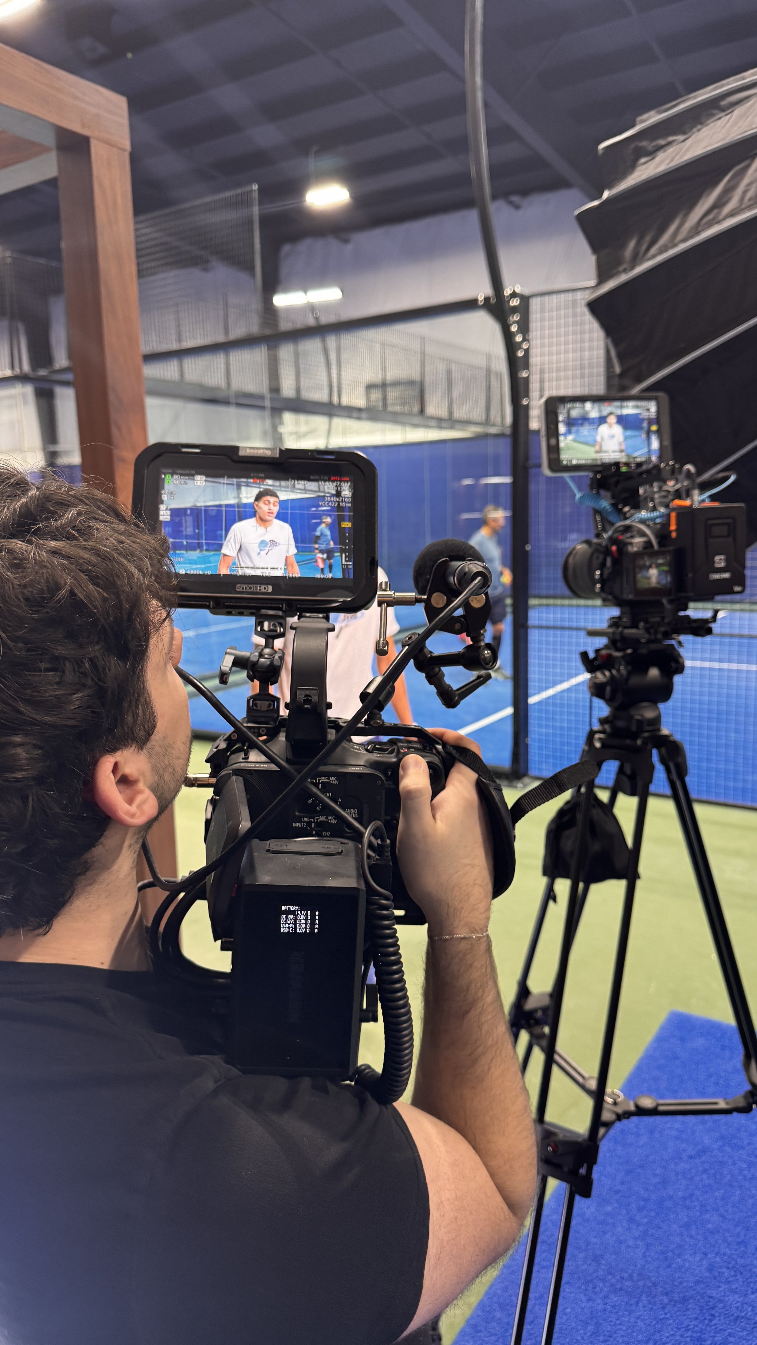 Behind-the-scenes at a Deadline Creative videography project featuring professional video production, athlete interviews, branded sports content, and commercial filming at Blue Zone Courts in Burlington, Ontario.