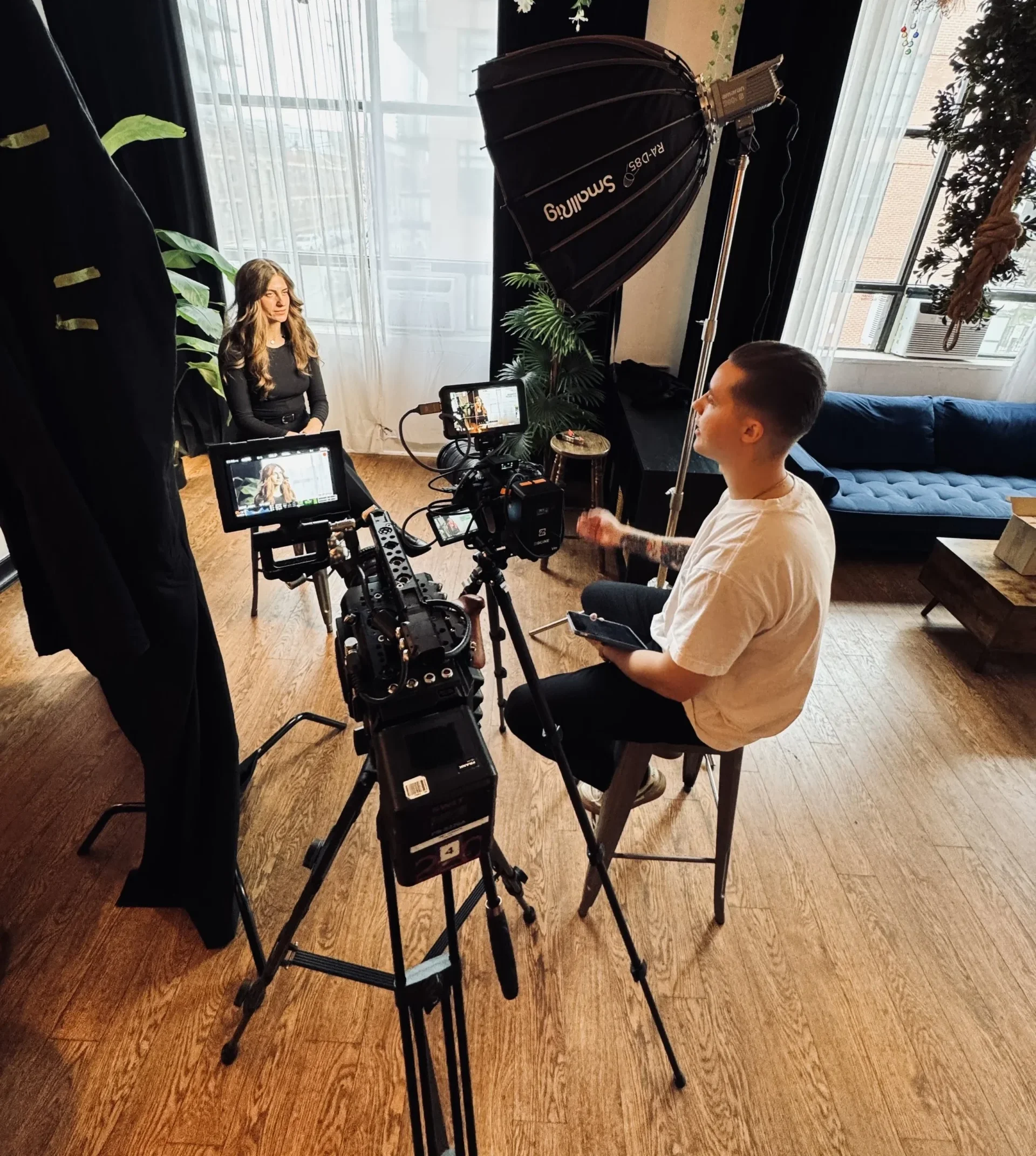 Behind-the-scenes at a Deadline Creative commercial video production shoot, featuring professional cameras, studio lighting, interview filming, and branded content creation for marketing and storytelling.